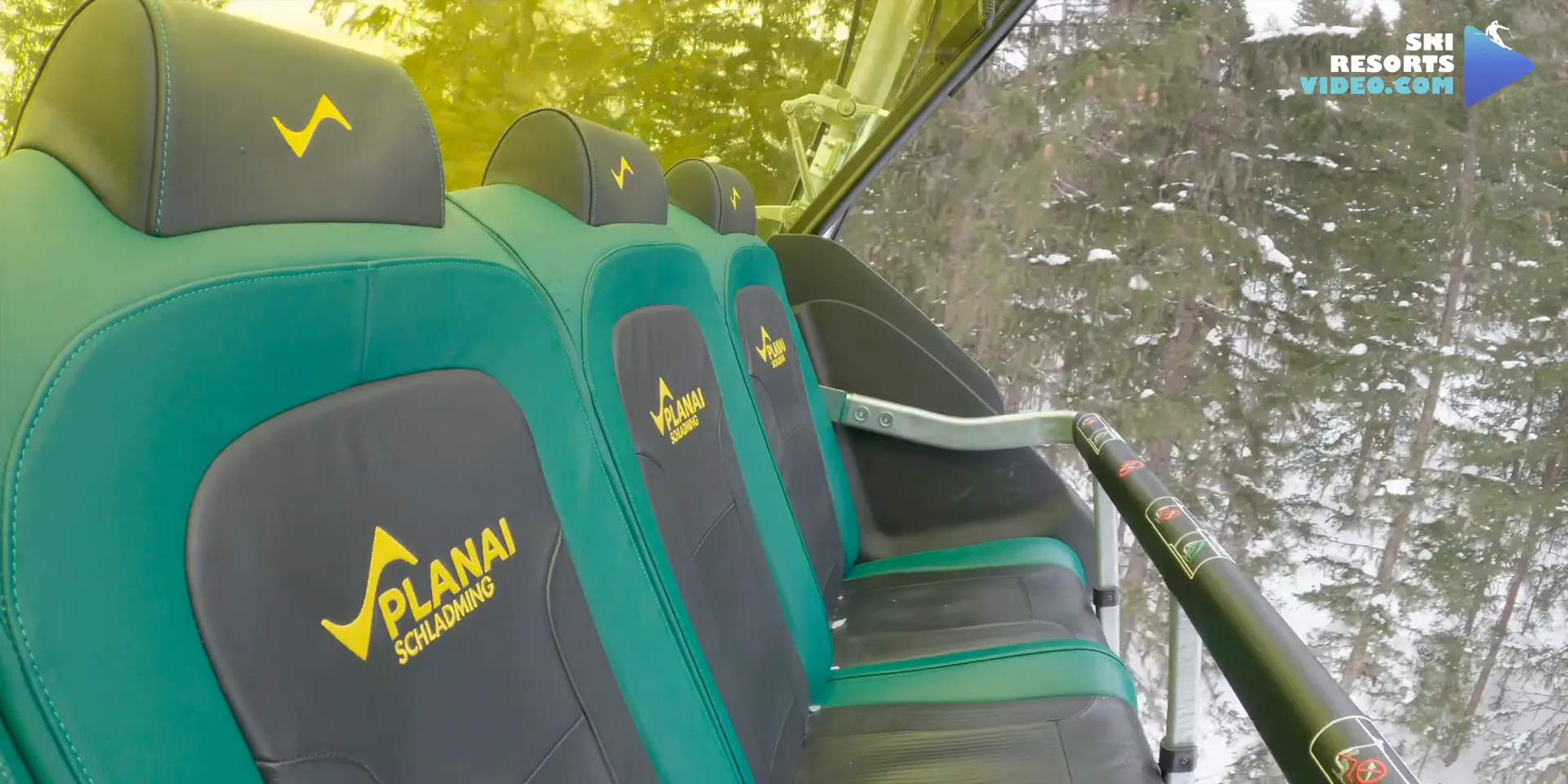Modern ski lifts transporting skiers up the mountain