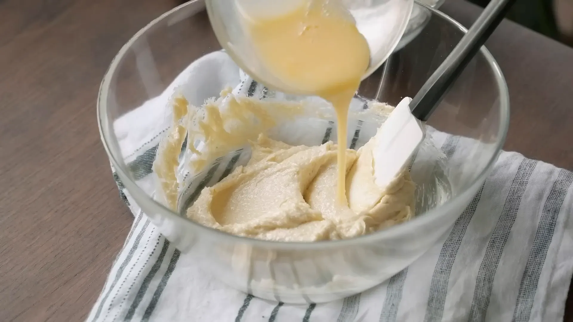 Mixing egg with butter and sugar