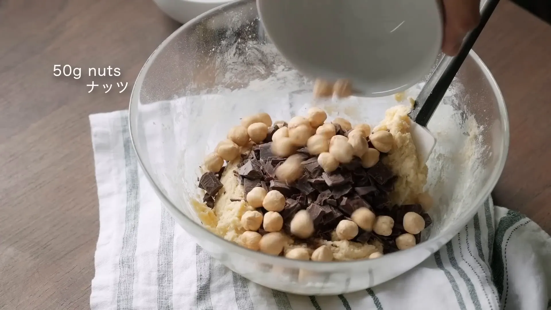 Adding hazelnuts to the cookie dough