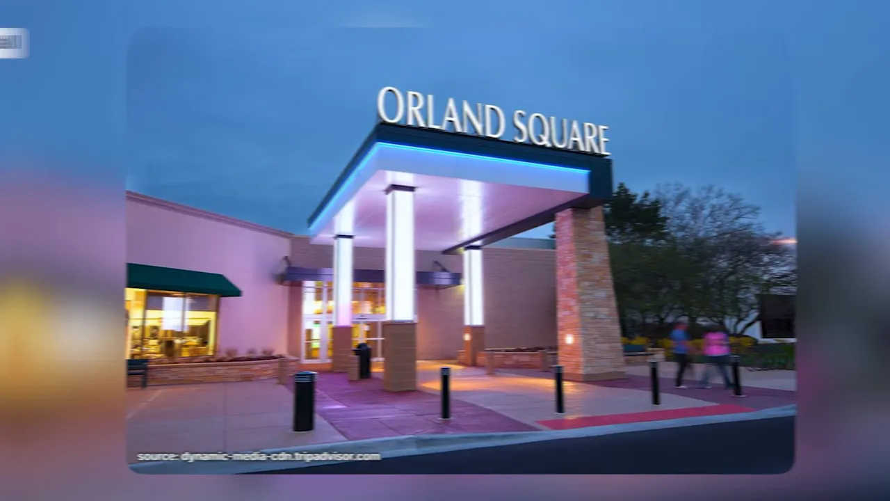 Entrance sign for Orland Square Mall at dusk