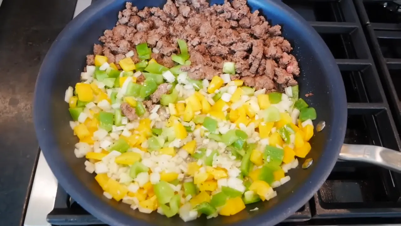 Mixing vegetables with bison