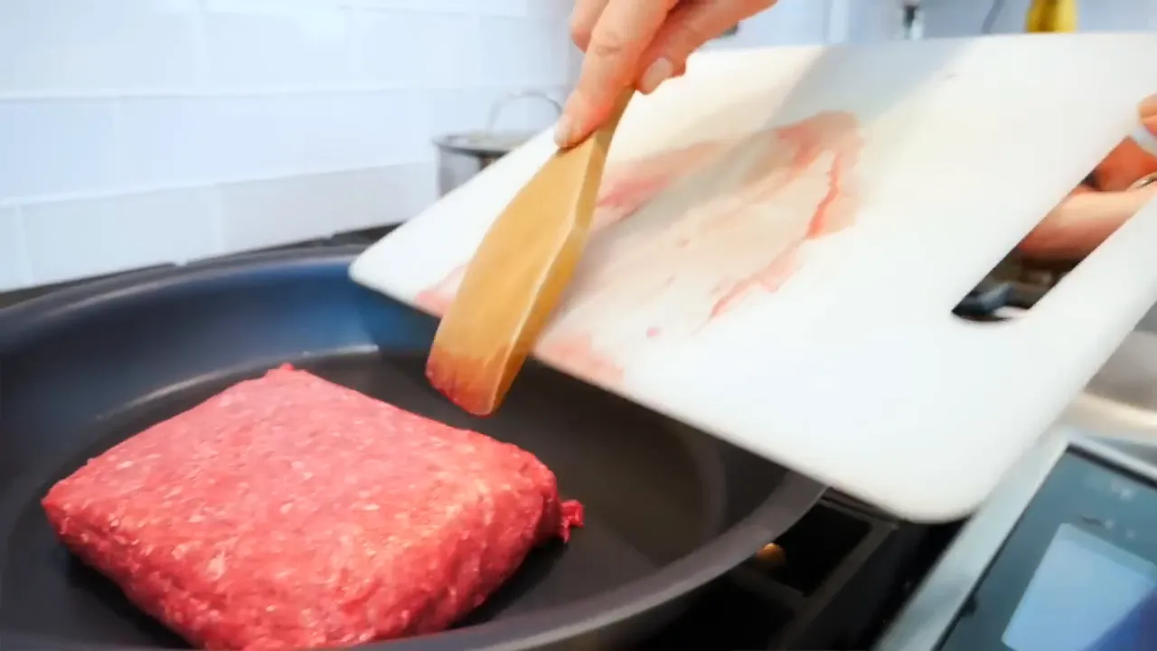 Ground bison cooking in a pan