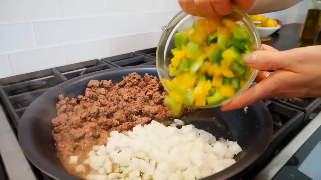 Adding vegetables to the pan