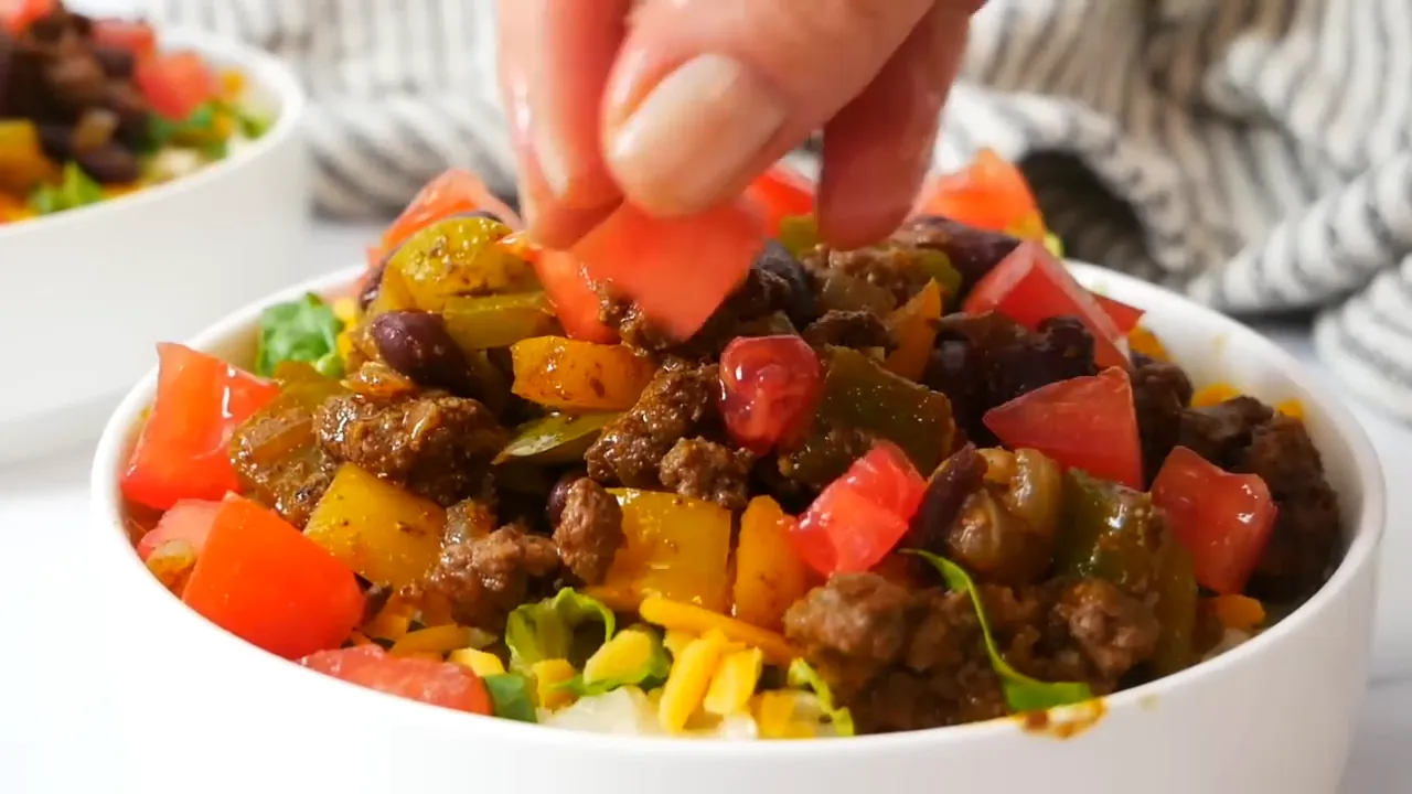 Adding bison mixture to the bowl