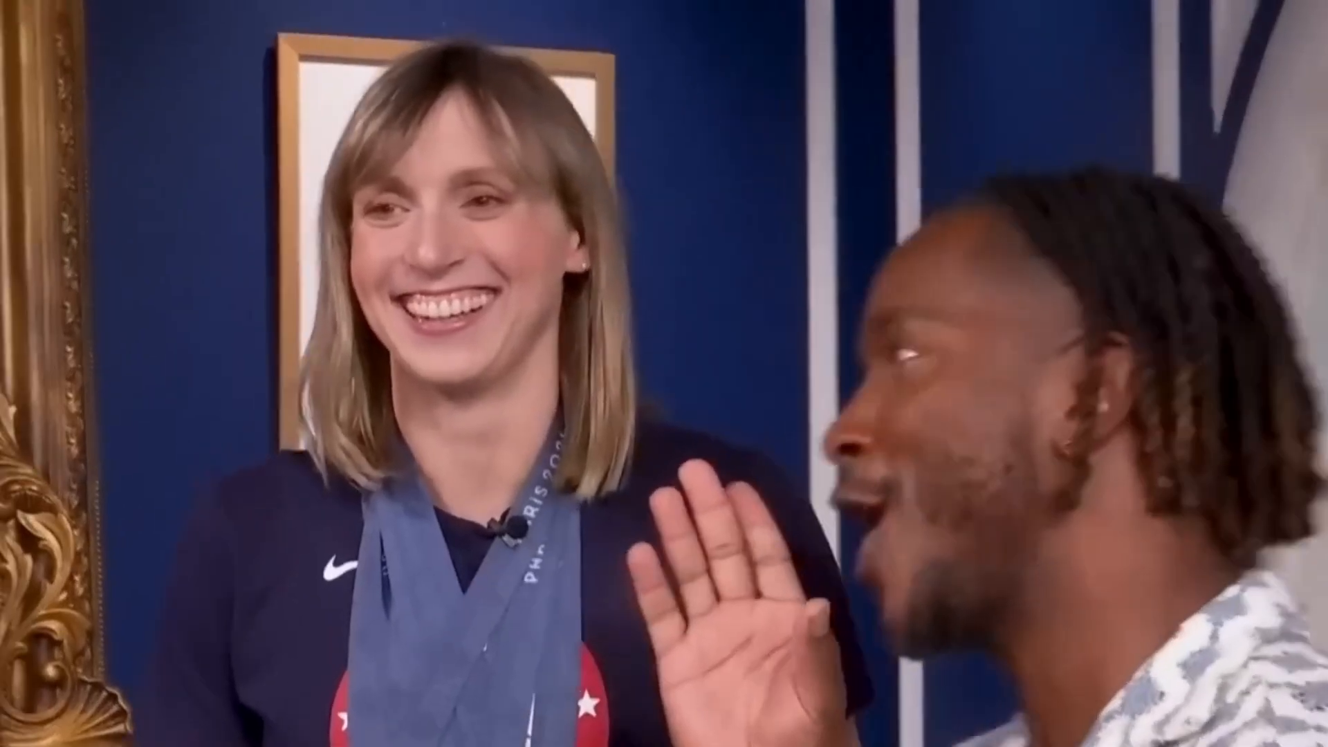 Katie Ledecky waving to young fan