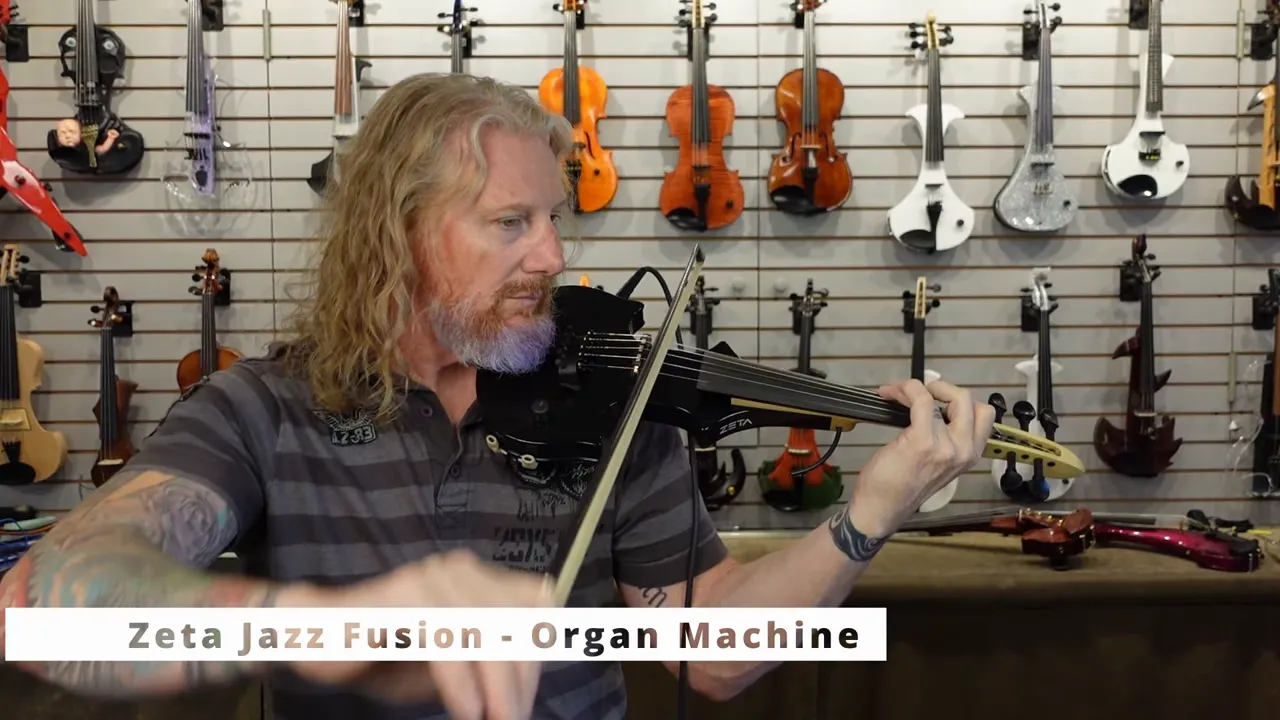 Player performing on a black Zeta Jazz Fusion electric violin with Zeta Jazz Fusion Organ Machine label