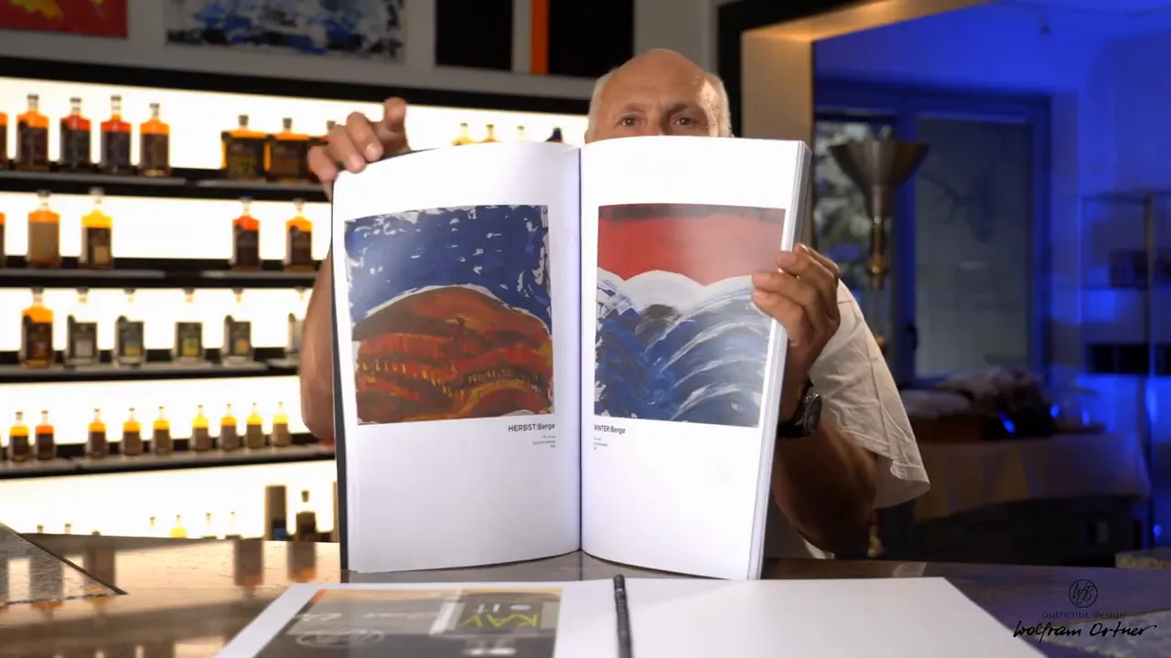 Photograph of a multi-page art book open to two spread pages showing paintings and commentary