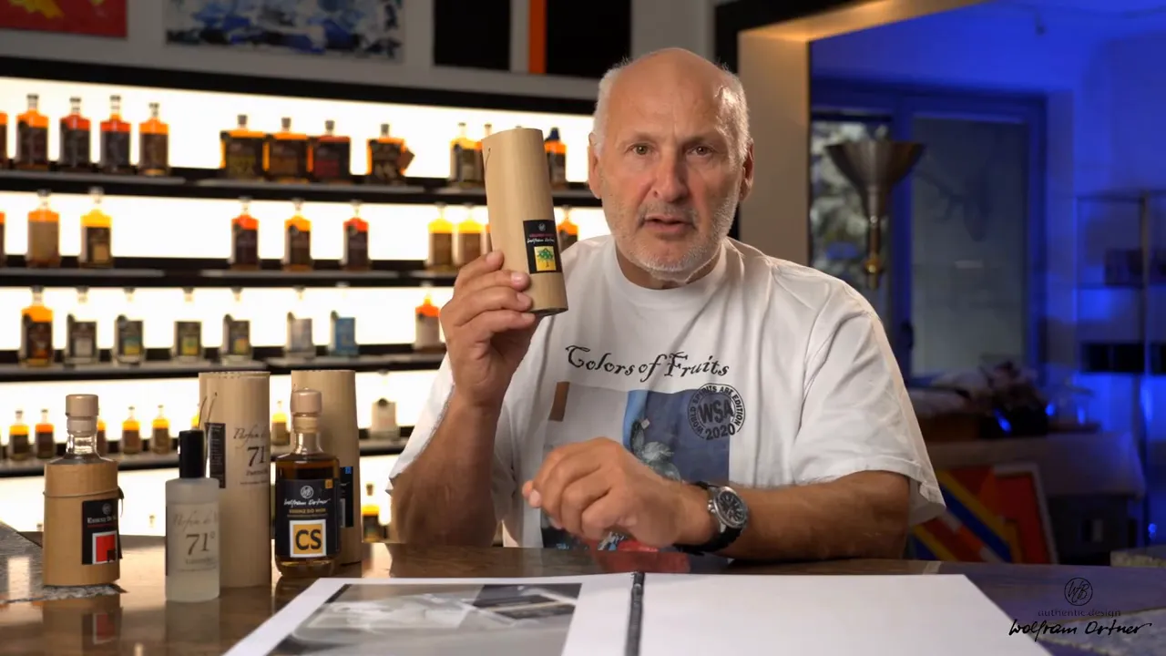 Presenter holding a cylindrical 71% essence package with multiple essence bottles on a backlit shelf