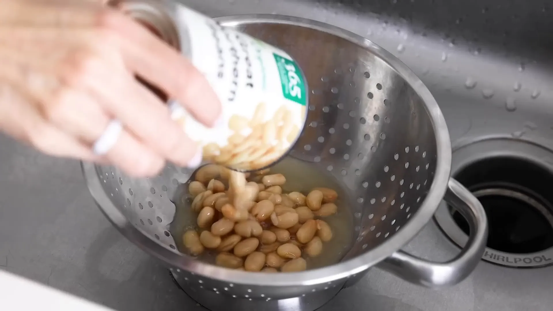 Adding canned beans to the salad