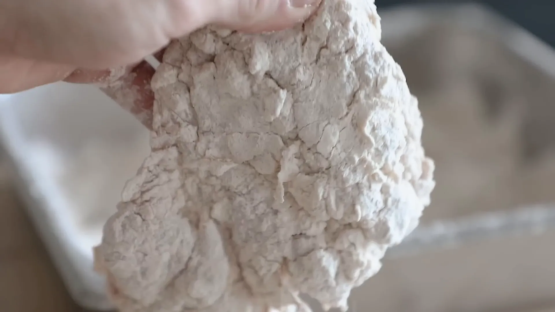 Chicken thighs coated aggressively in seasoned flour dredge