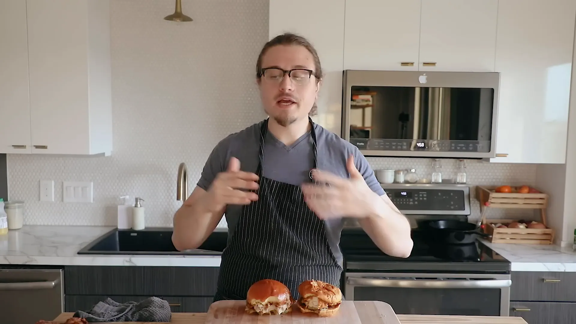 Side by side comparison of homemade chicken sandwich and Popeyes chicken sandwich