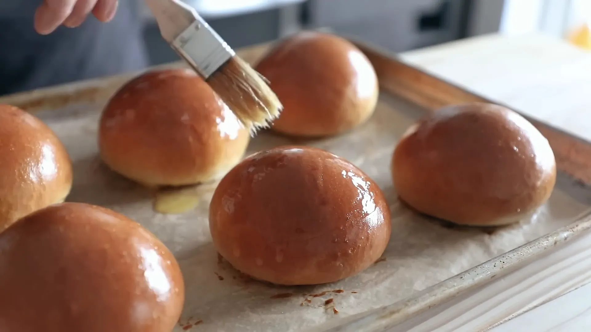 Freshly baked Japanese milk buns with shiny golden tops