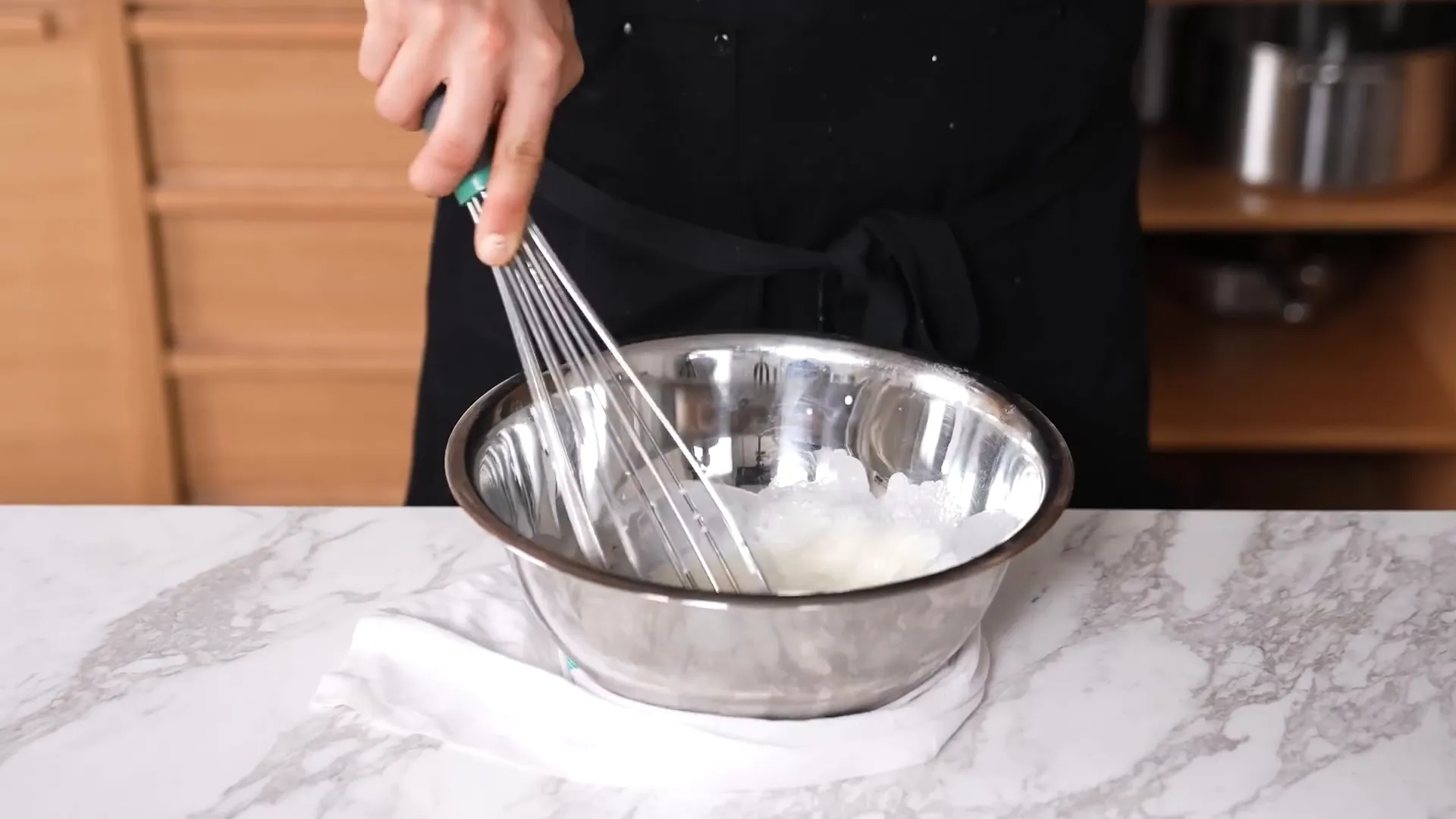 Damp towel wrapped around mixing bowl