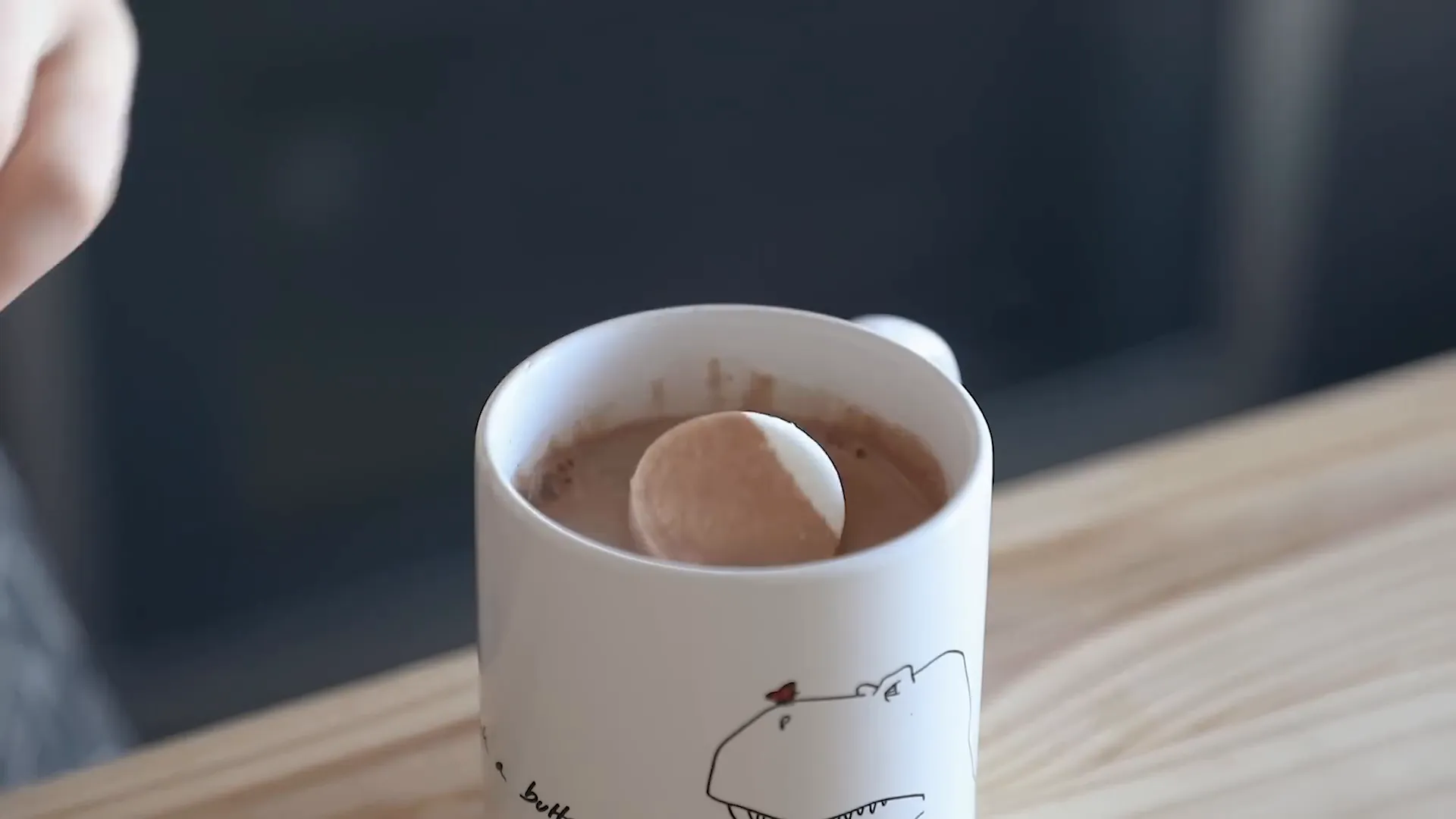 Mixing instant hot chocolate with marshmallows on top