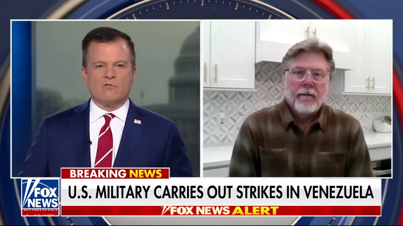 Television split-screen showing a studio anchor and a remote expert, accompanied by a breaking news banner about U.S. military strikes in Venezuela.