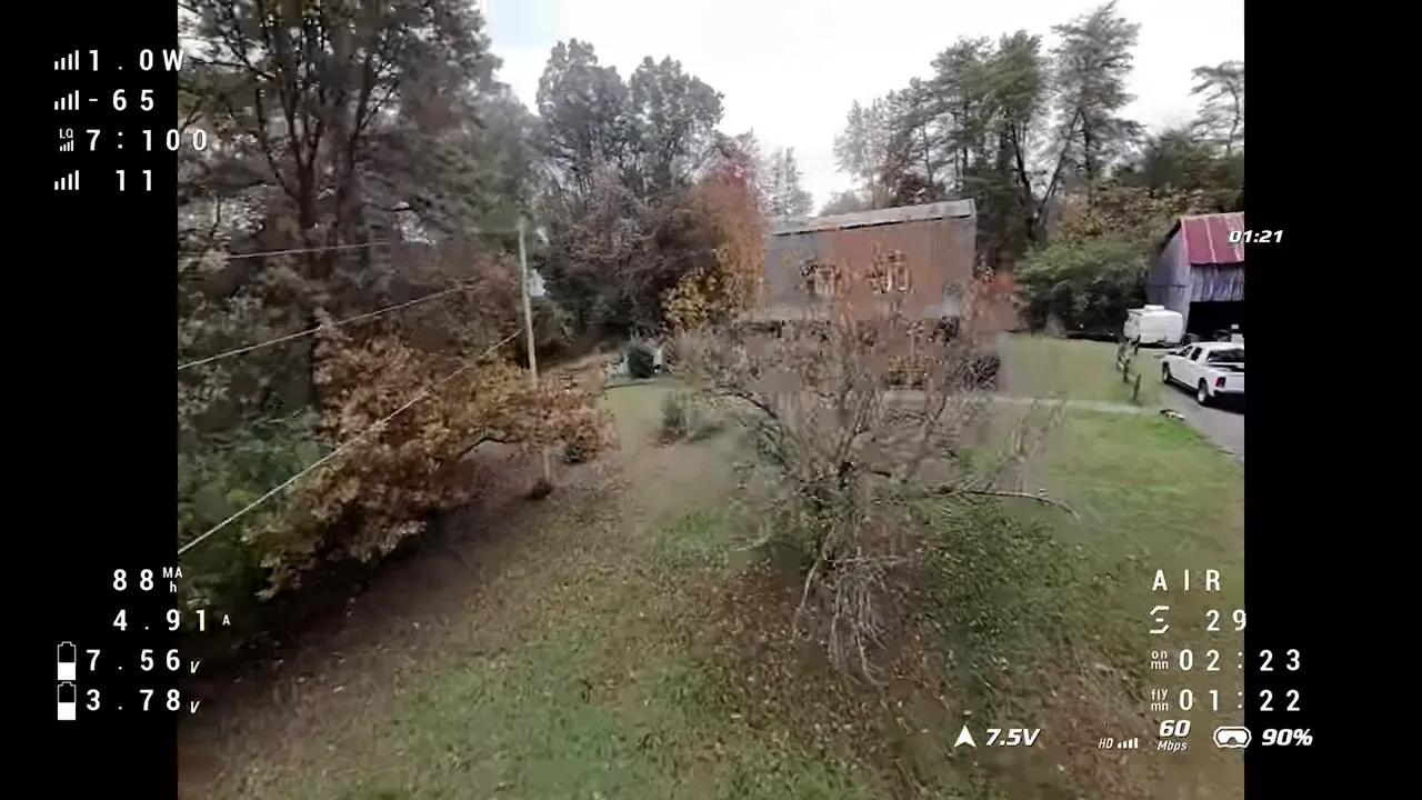 Pavo Pico II forward flight over yard with telemetry overlay showing level, stable horizon and battery telemetry