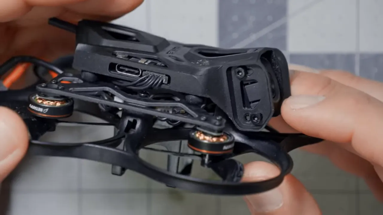 Close-up of BetaFPV Pavo Pico II canopy showing bobbin soft-mount, USB port and wiring