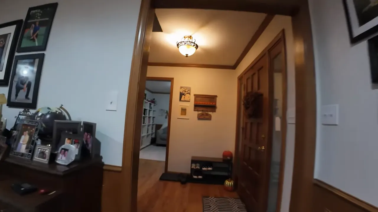 POV hallway shot from the DarkStar22 showing a doorway, ceiling light and narrow entry hall