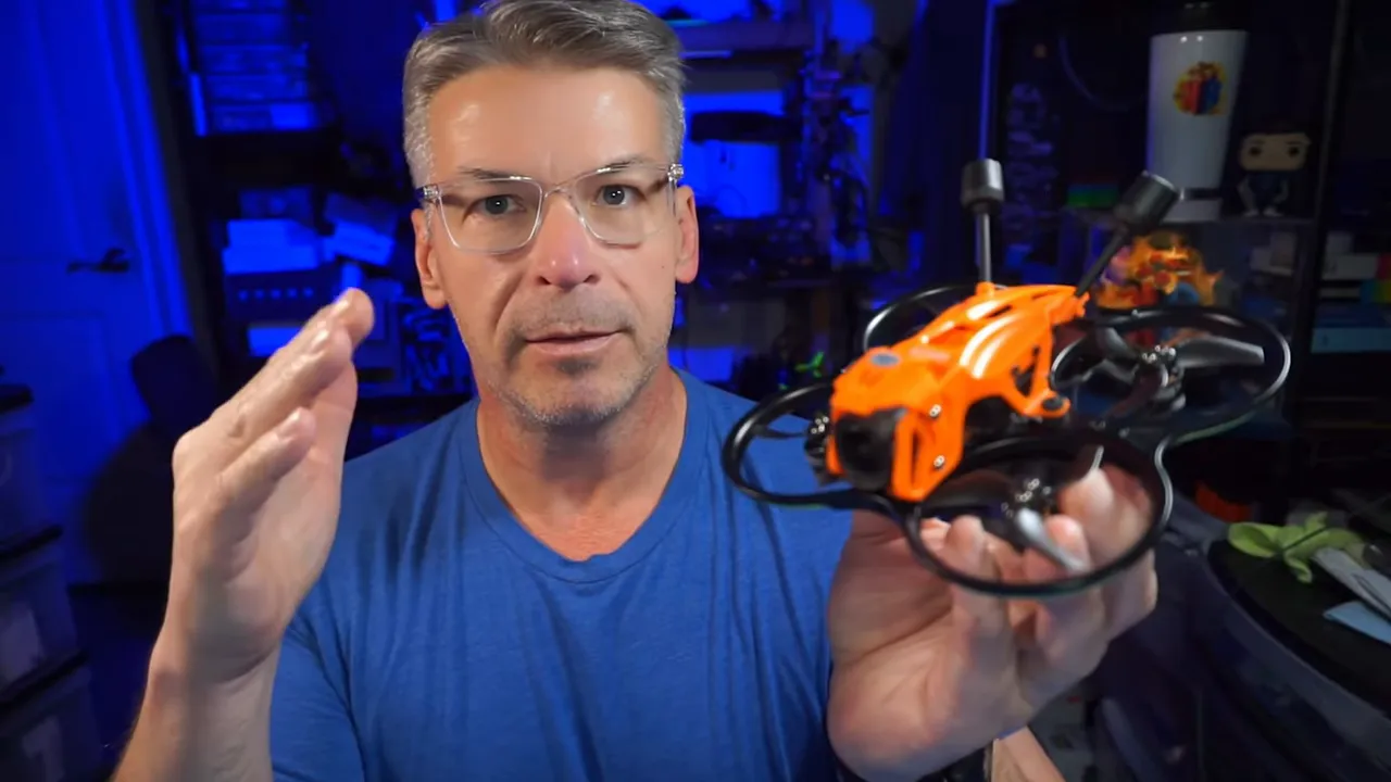 Front view of DarkStar22 micro whoop showing the orange floating canopy, canopy screws and ducted props