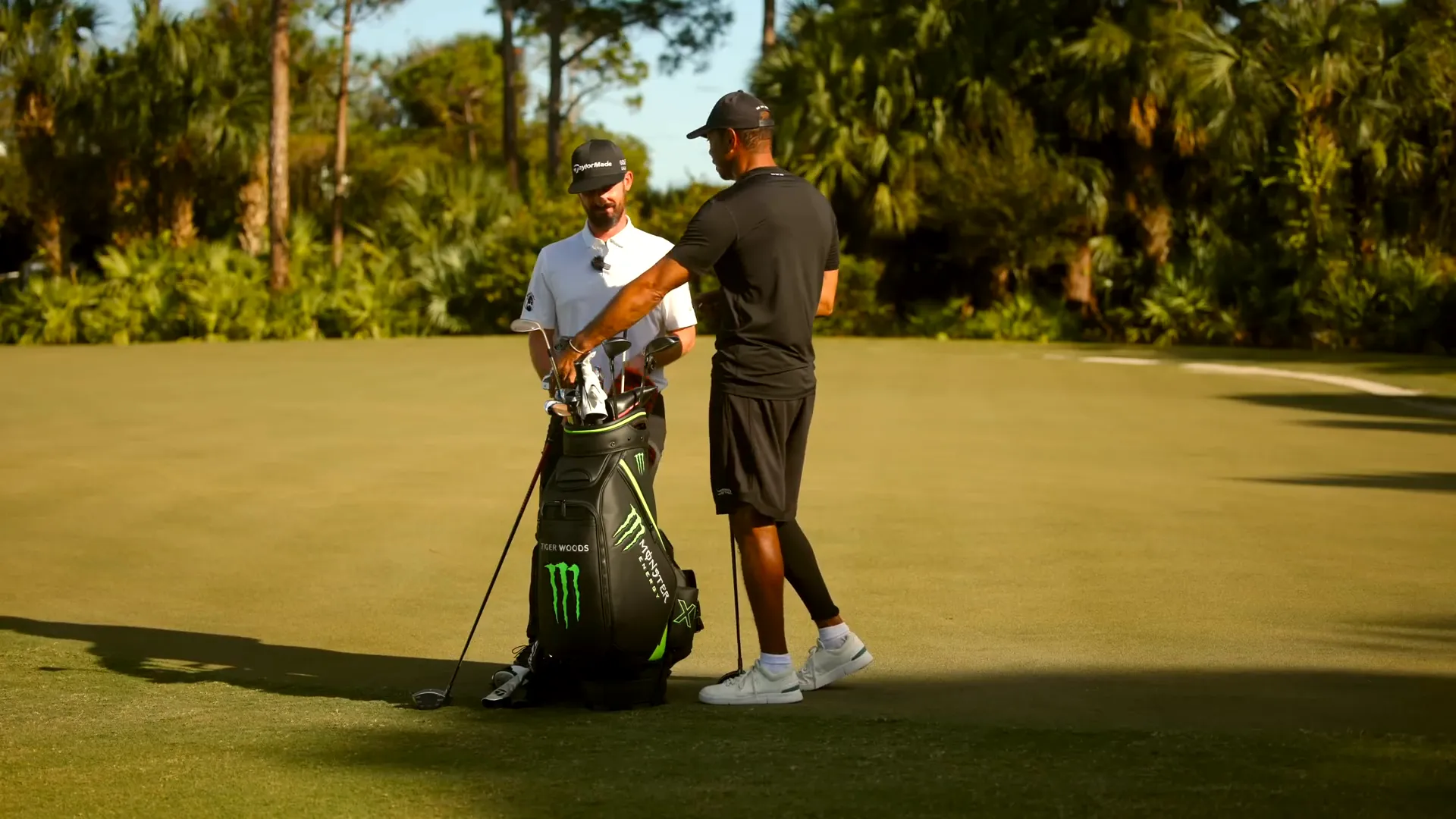 Tiger Woods using iron shafts for alignment