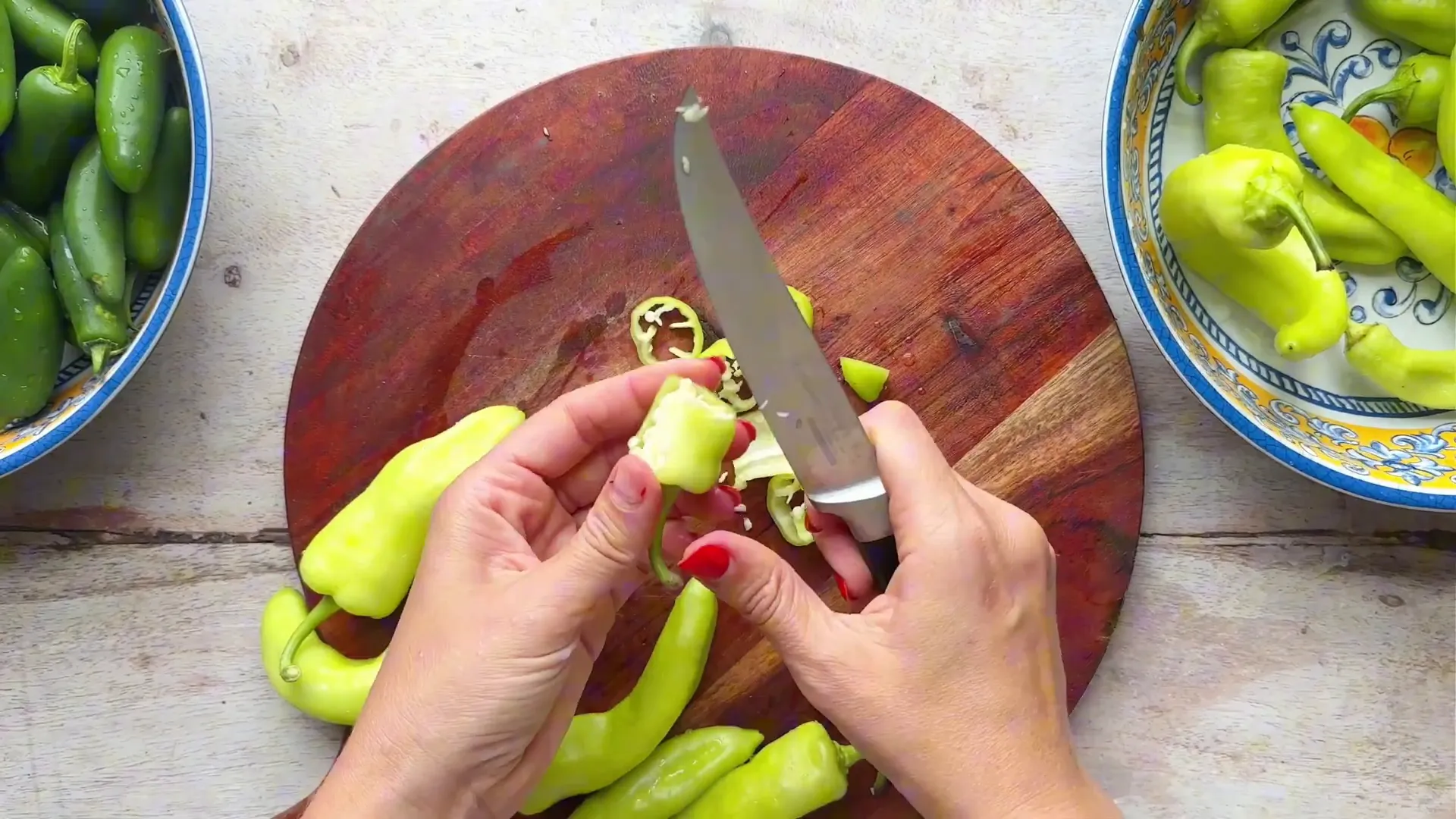 Slicing banana peppers into rings and removing seeds