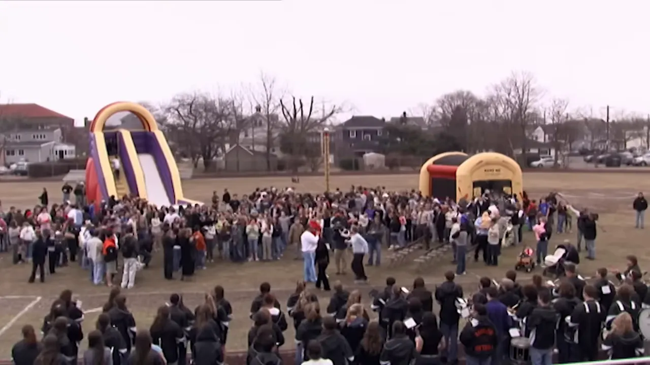 Babylon Family Day: trays of lasagna served buffet-style during community event