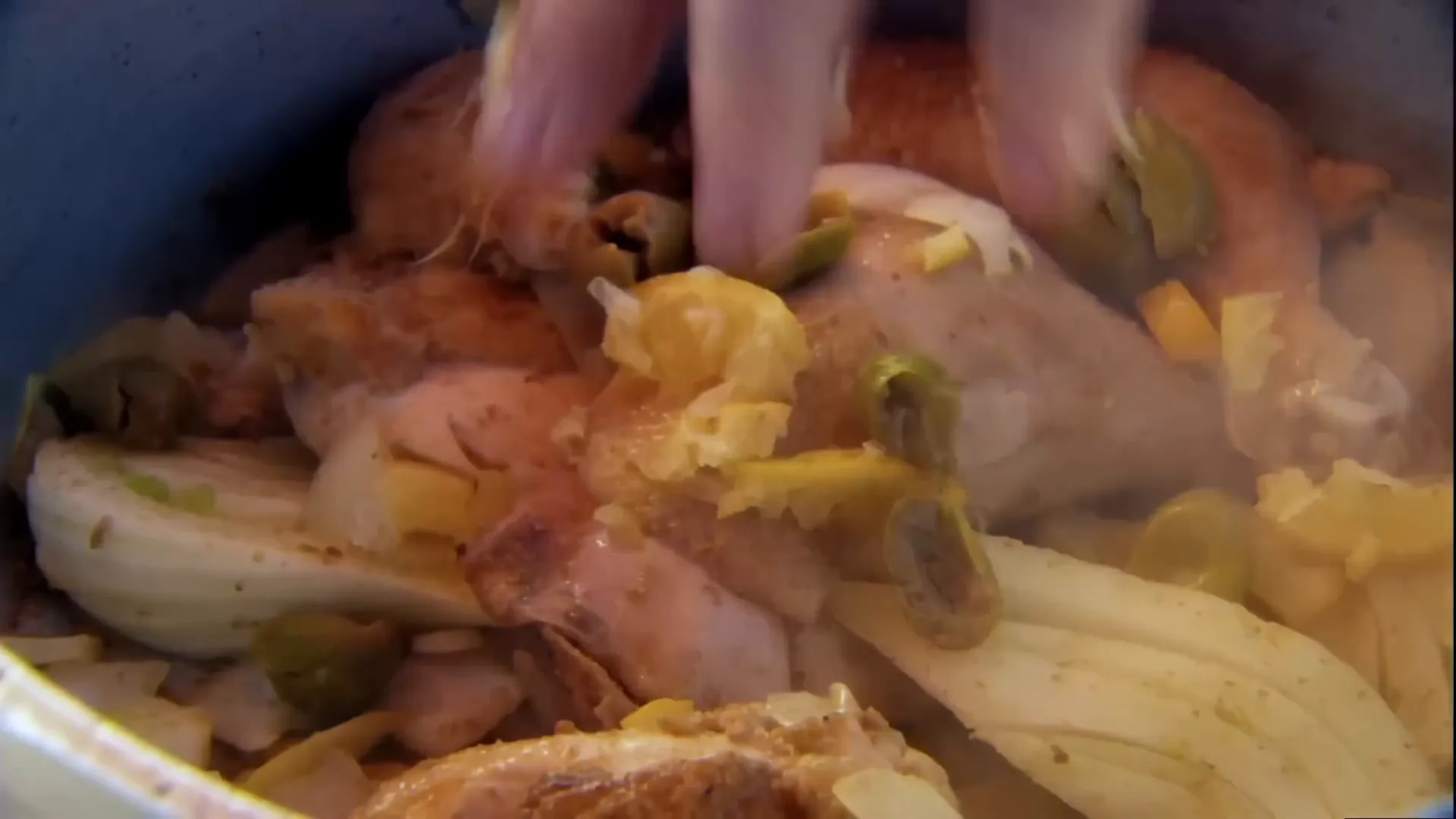 Adding salted lemon, olives and saffron to the pan