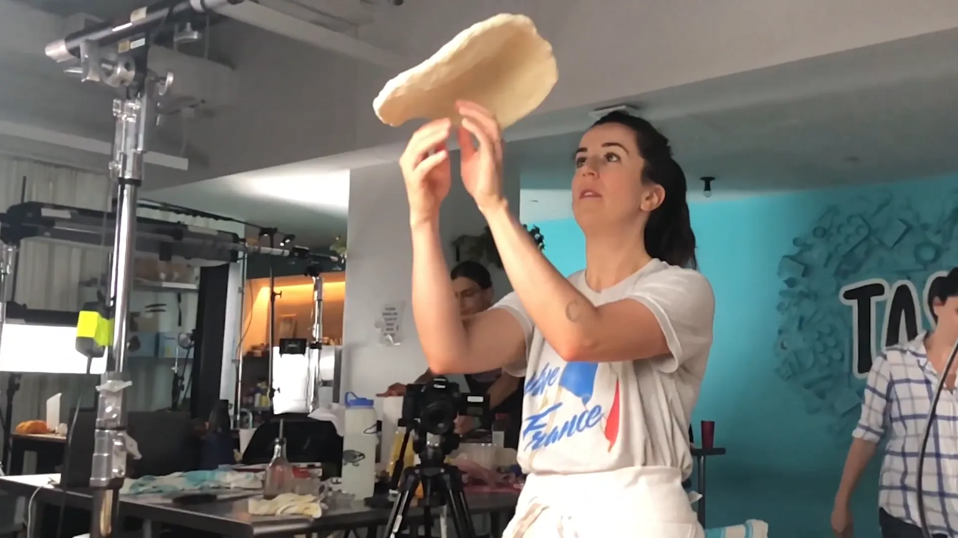 Tossing pizza dough in the air