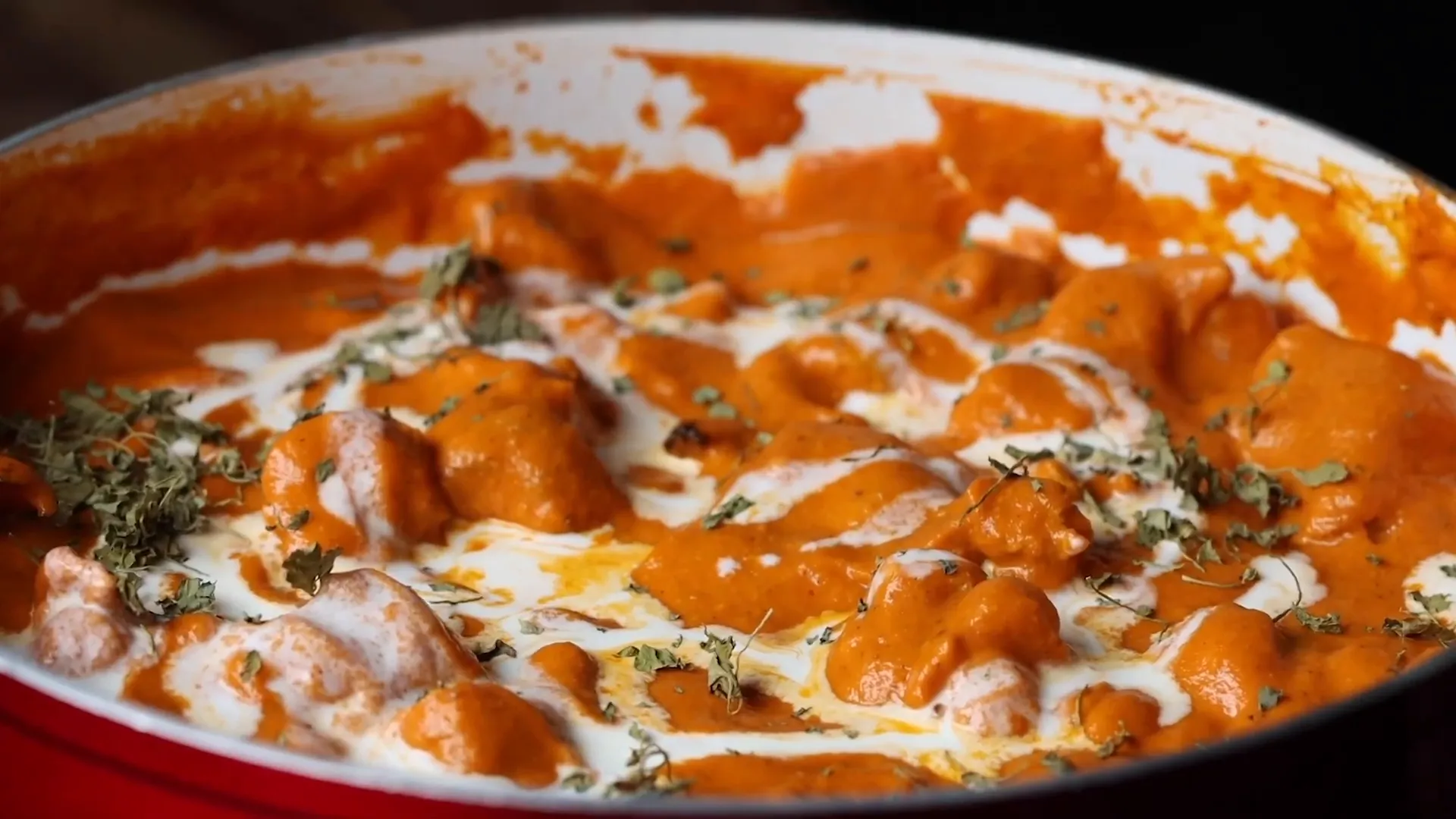 Creamy butter chicken served with naan bread