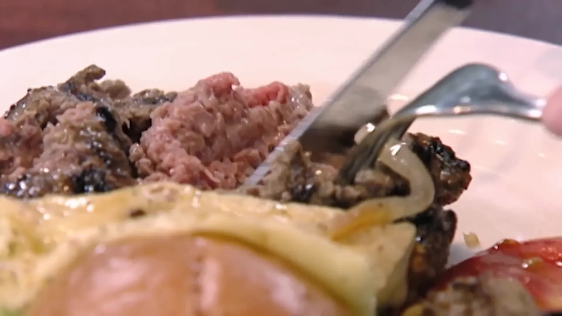 Undercooked medium rare burger