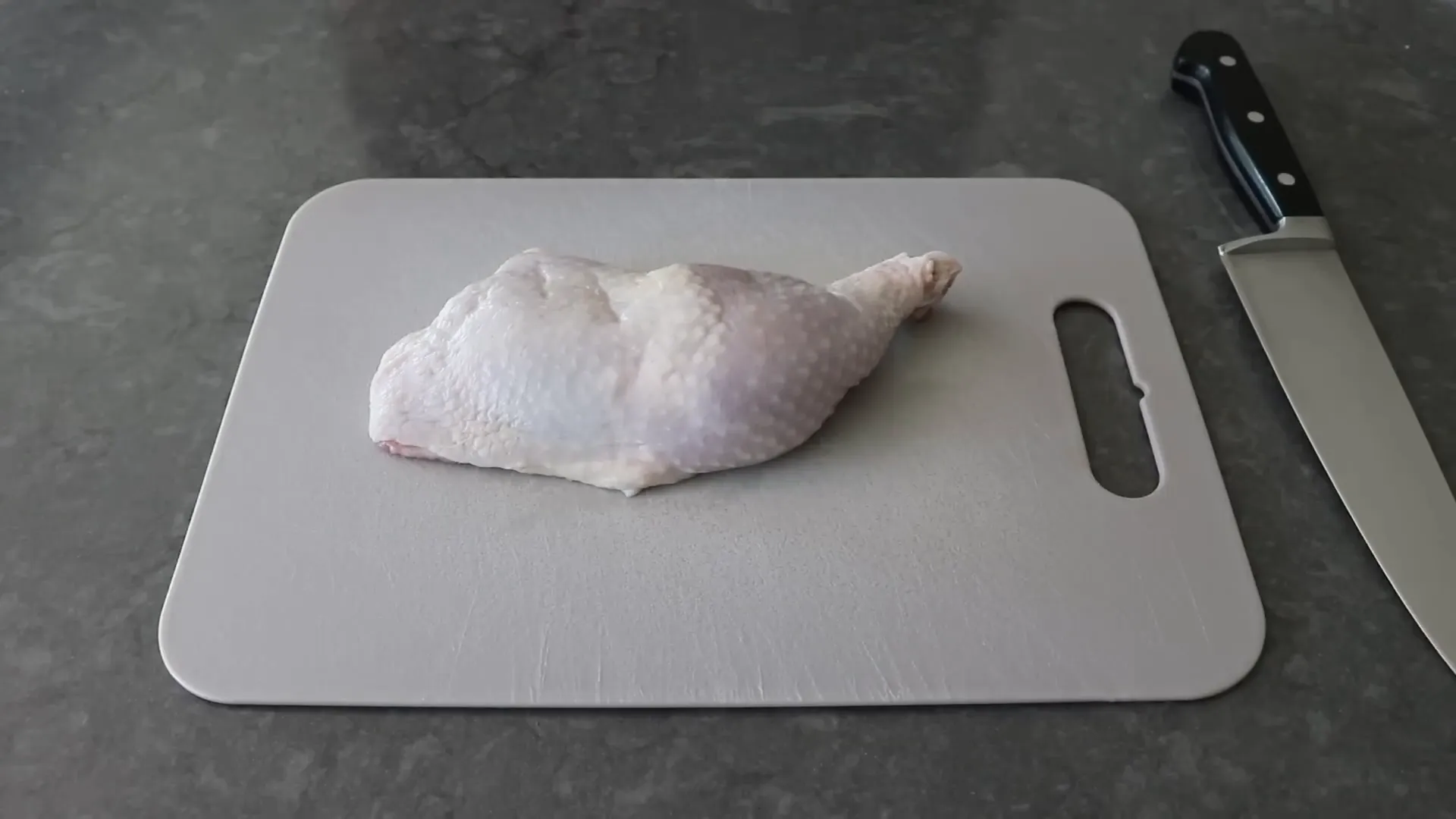 Chicken leg quarters ready for tiger cut preparation