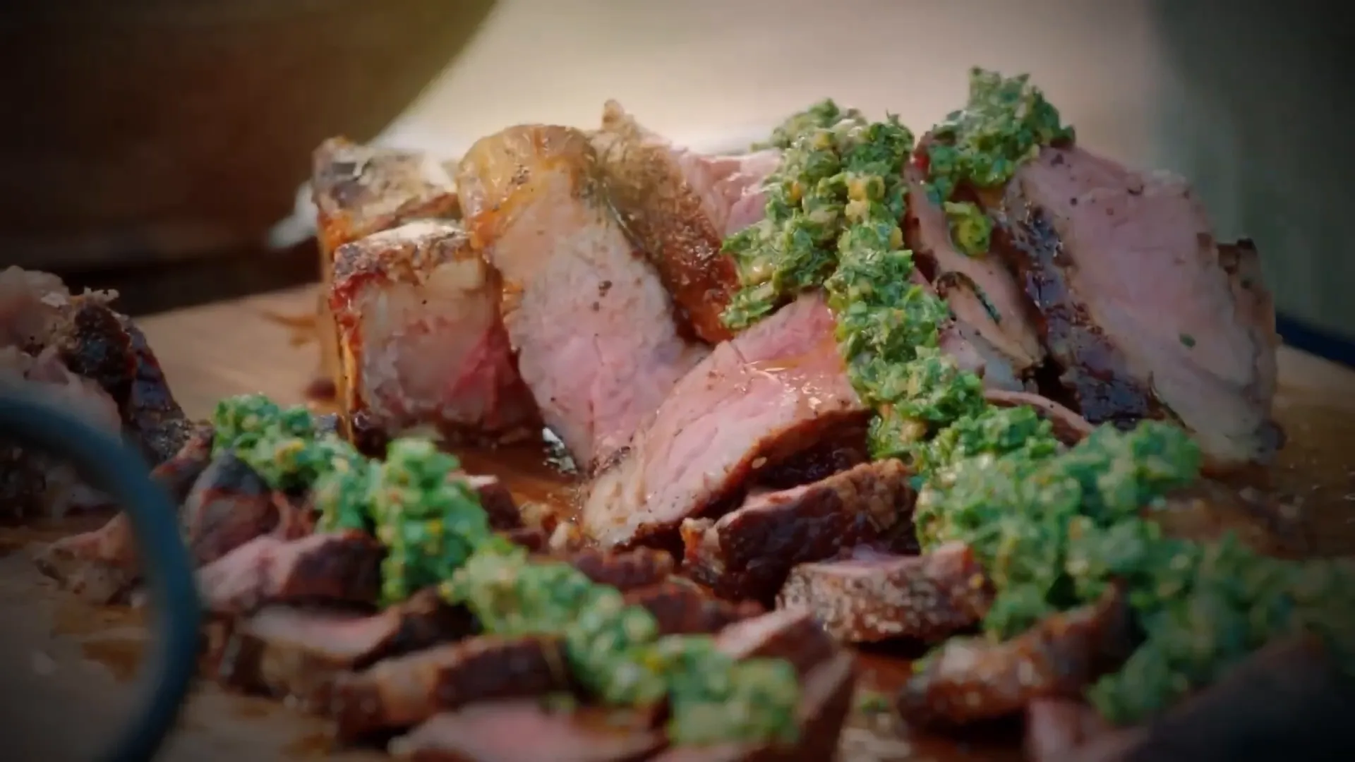 T-bone steak sizzling with fat rendering