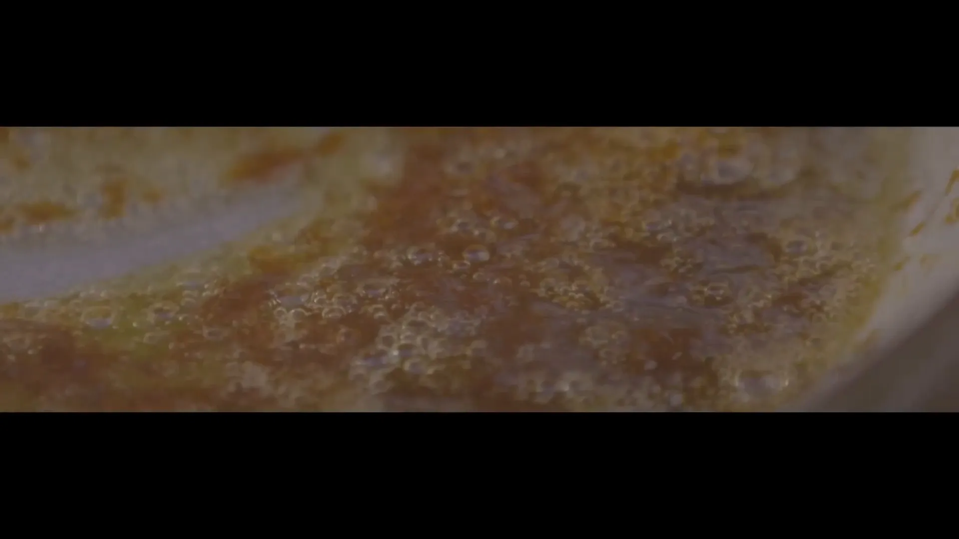 Cooking sweet and sour caramelized onions in pan