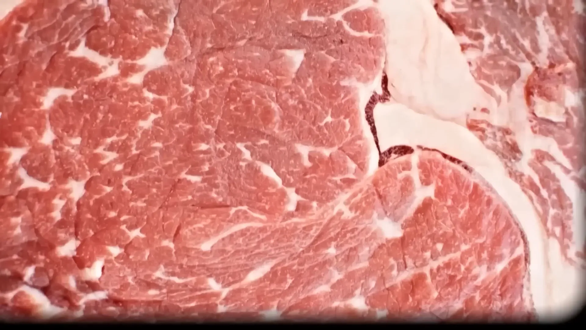 Close-up of cote de beurre steak with fat marbling