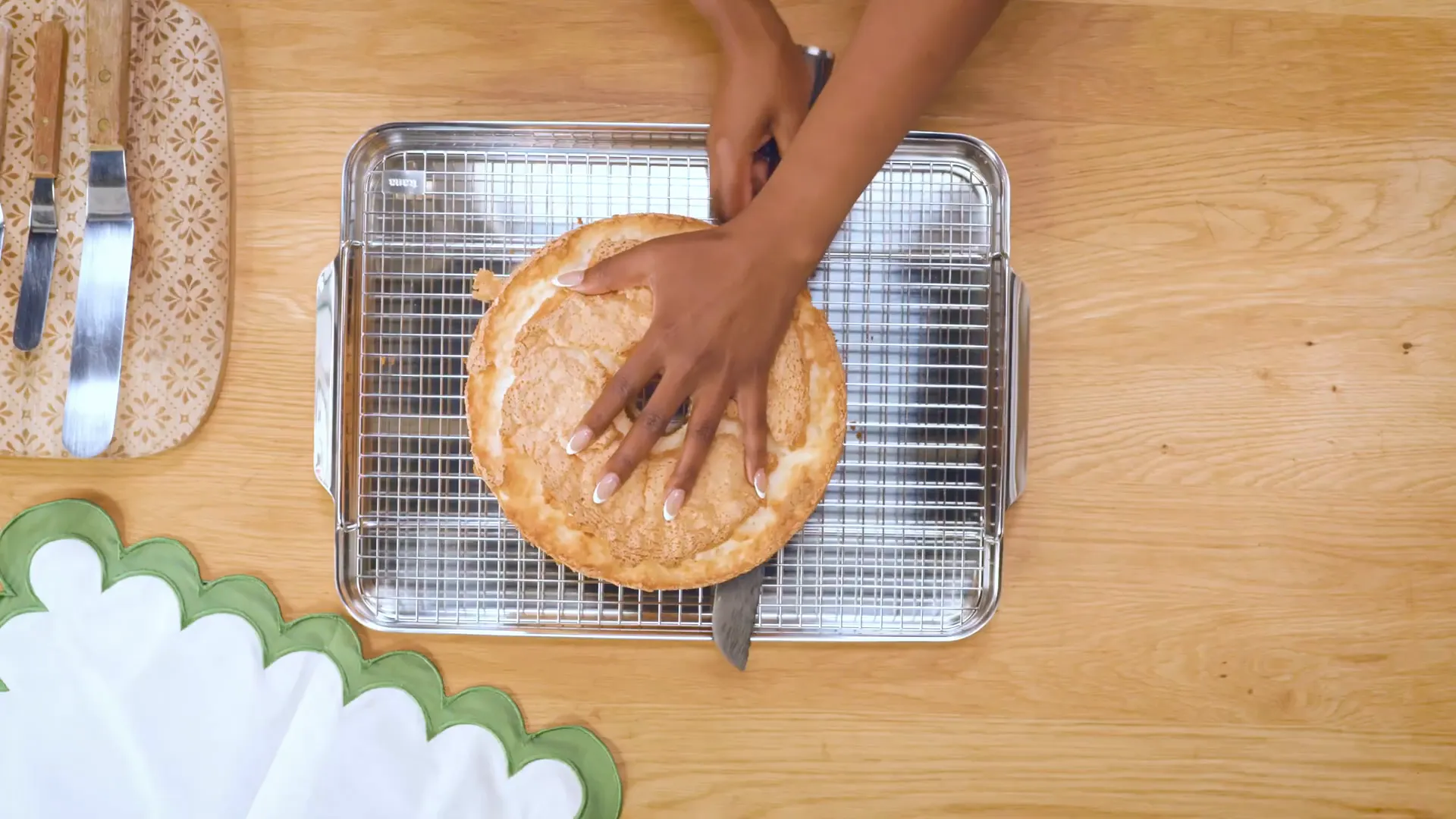 Cutting angel food cake in half for assembling the Kwanzaa cake