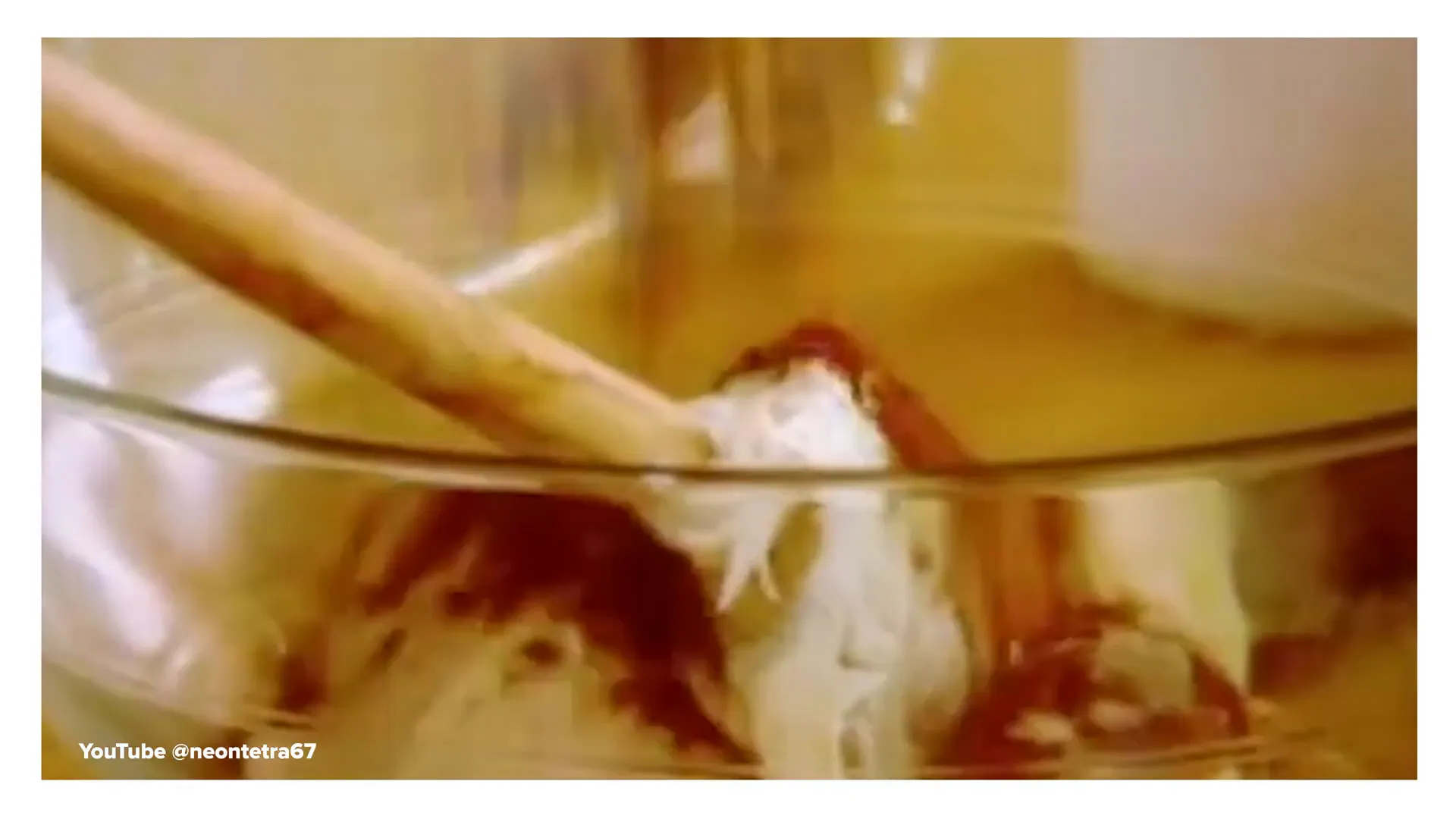 Mixing cinnamon, cocoa powder, and vanilla frosting for the cake