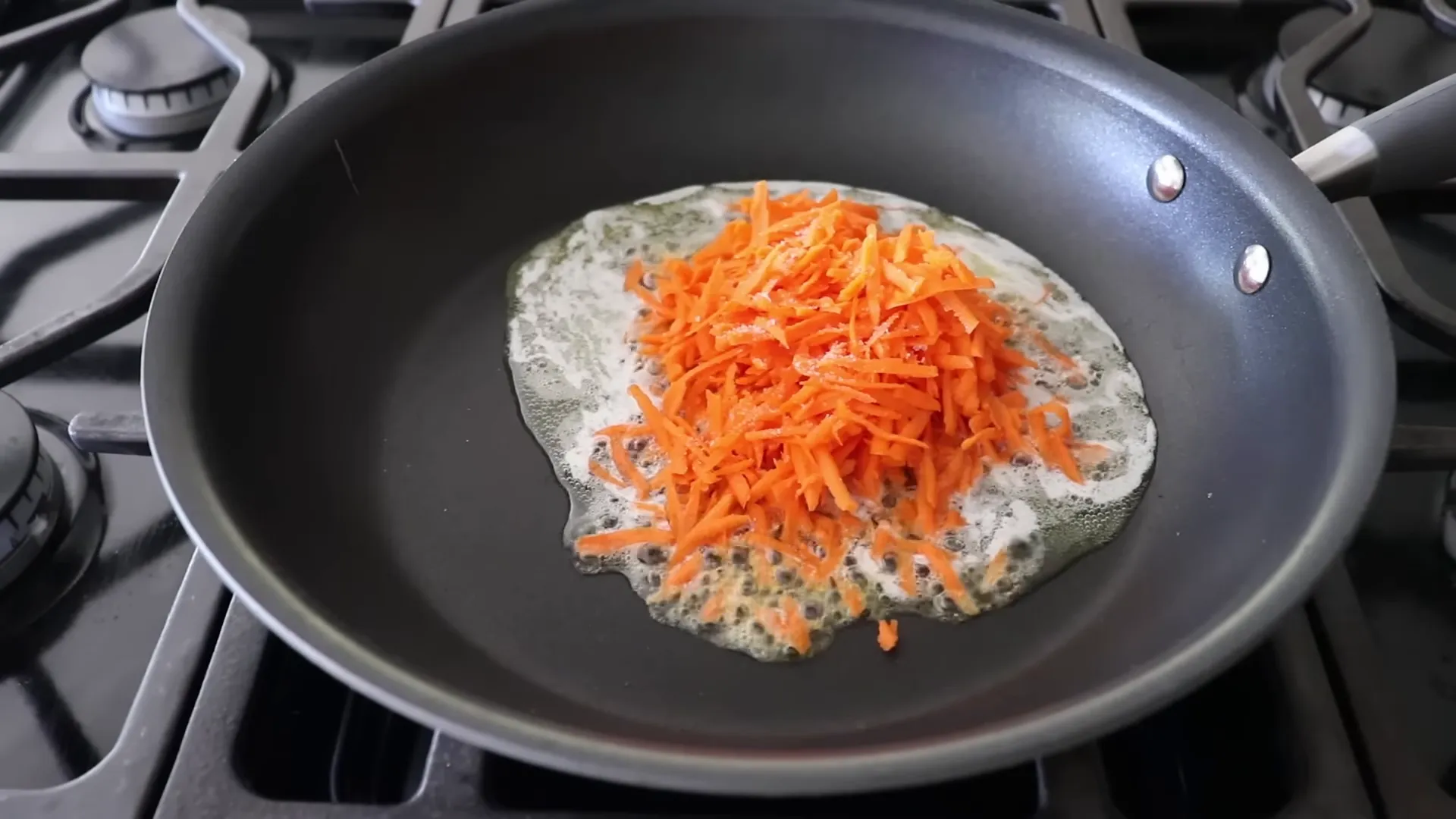 Sautéing grated carrot in butter