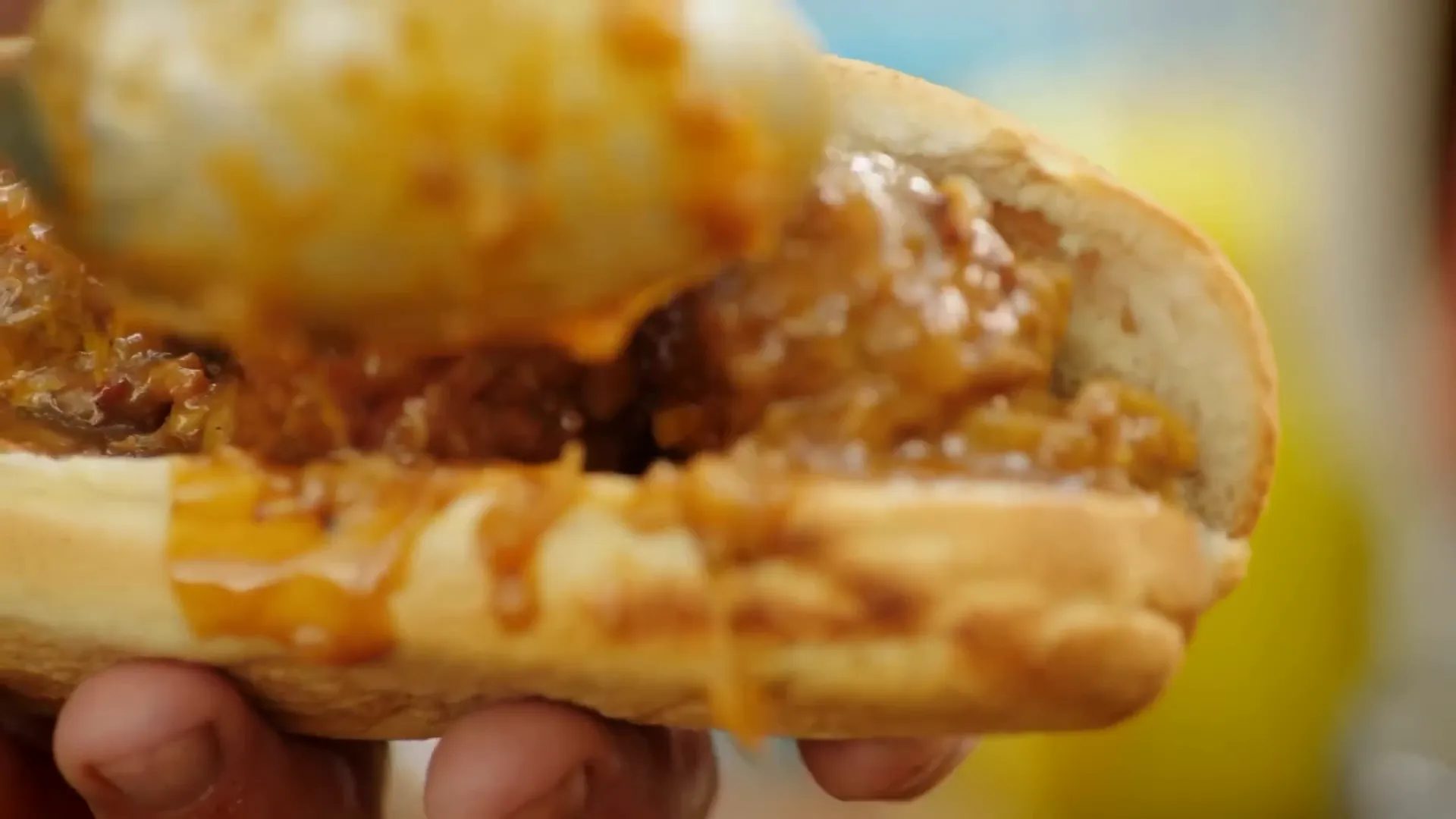 Meatballs with melted cheese and rosemary in a fluffy sub roll
