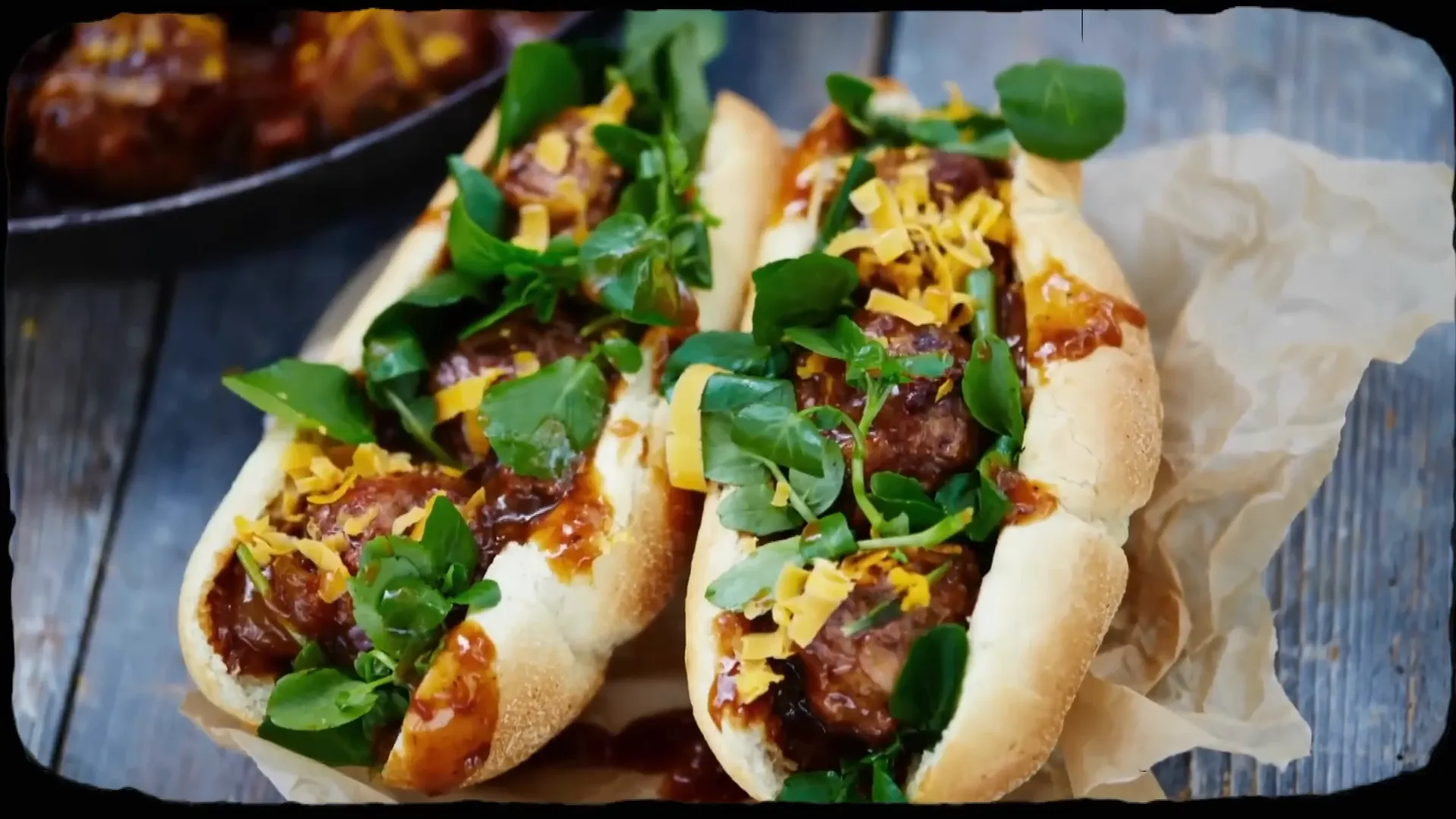 Juicy meatballs with melted cheese and chunky gravy in a soft sub