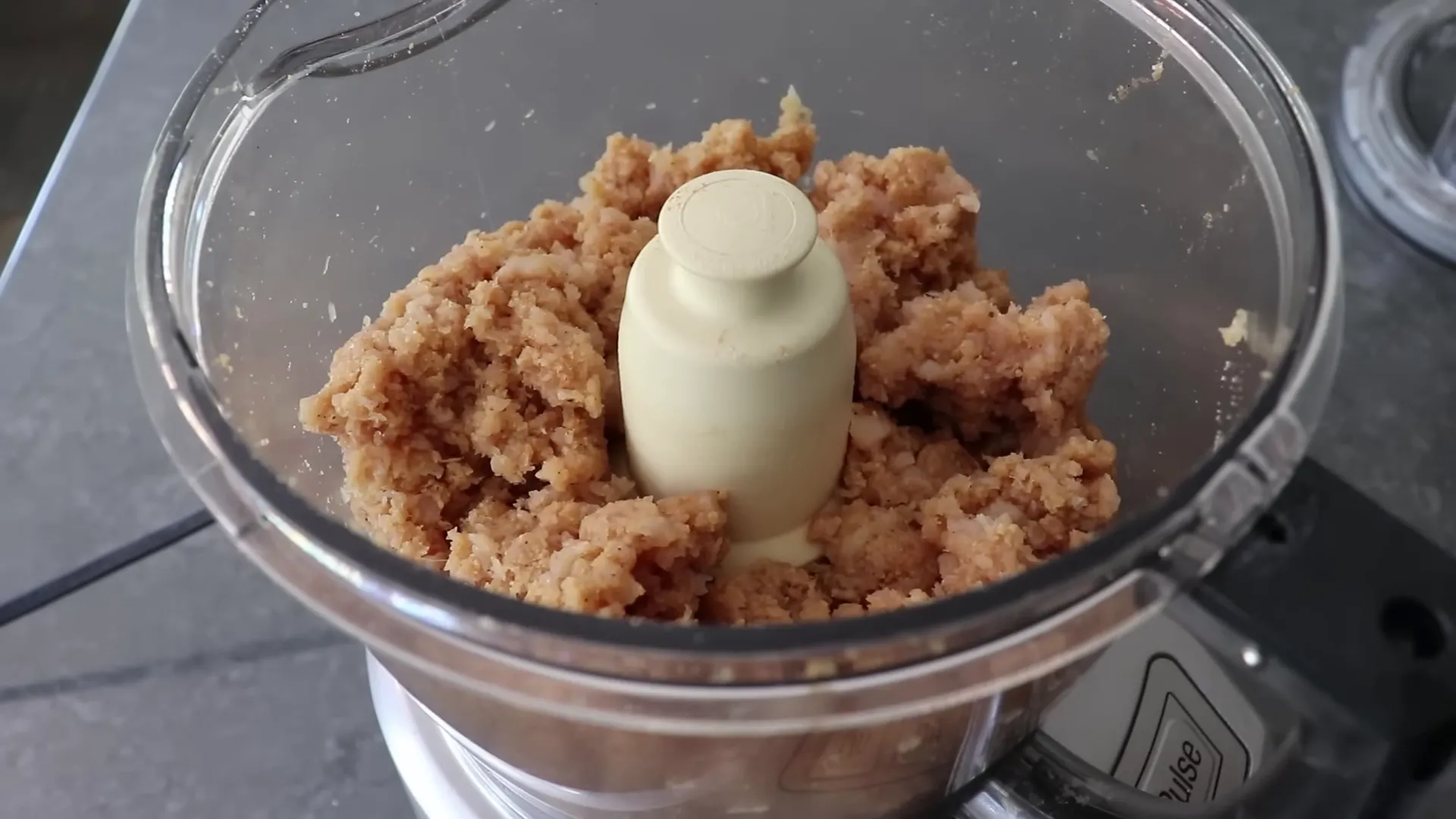 Processed chicken mixture showing coarse texture