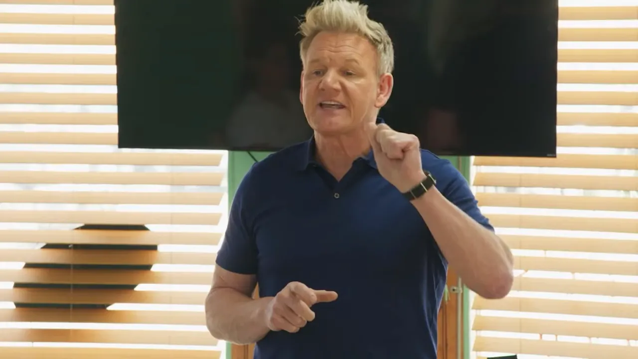 Chef or consultant giving a direct briefing to staff in a restaurant meeting