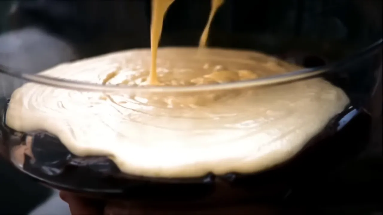 Assembling tiramisu and shaving chocolate for the top