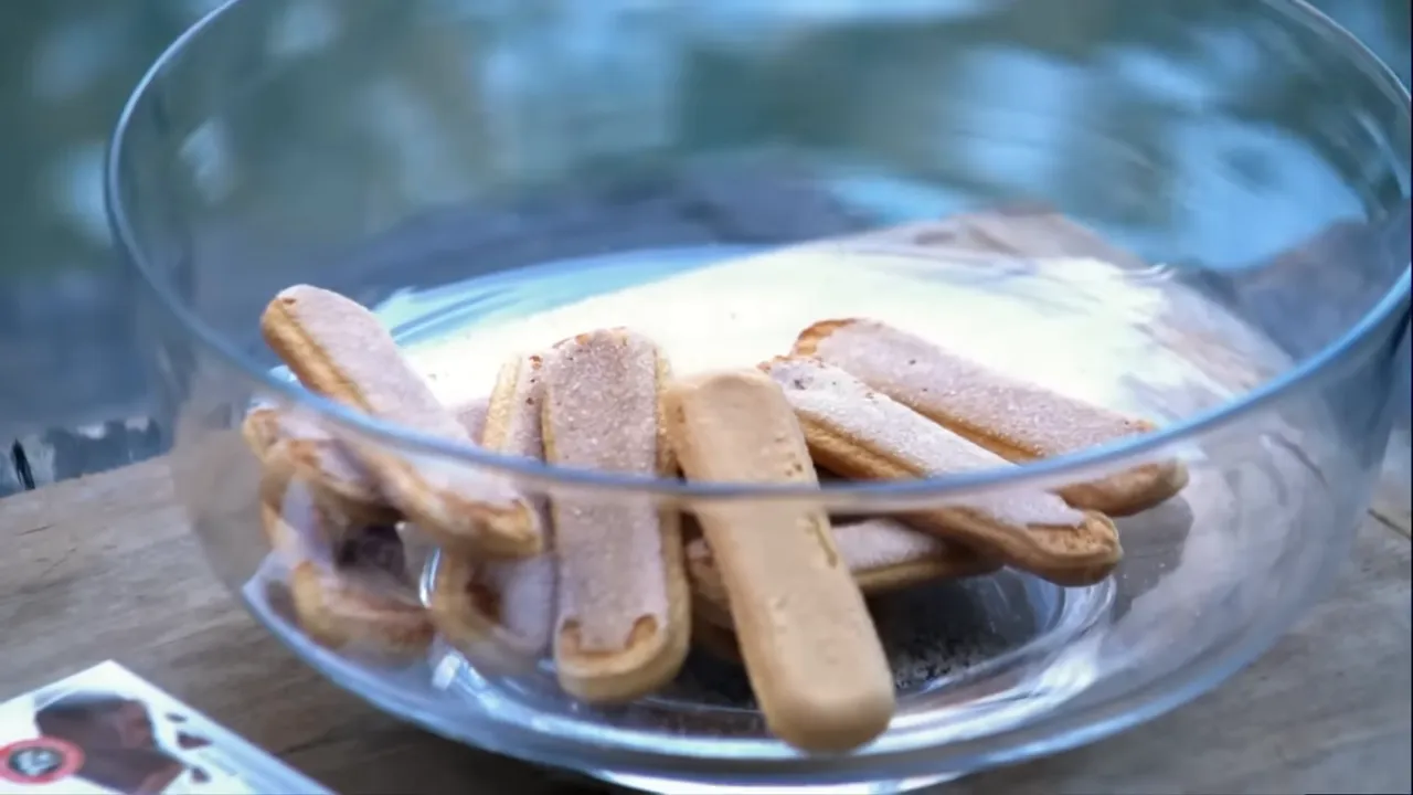Emptying sponge fingers into a bowl