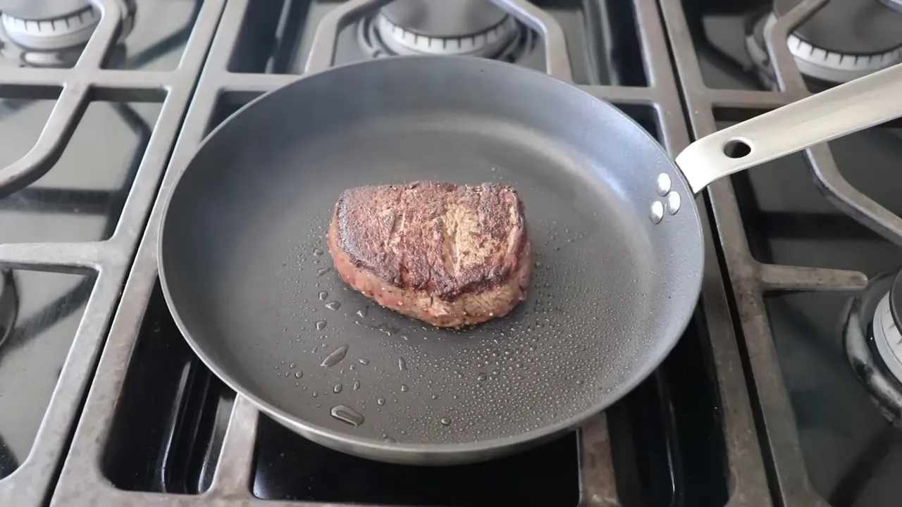 evenly seared beef tenderloin in a nonstick skillet