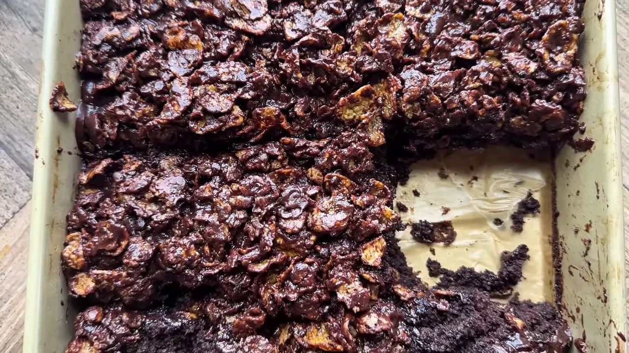 Slice of the fudgy chocolate cake showing the glossy ganache