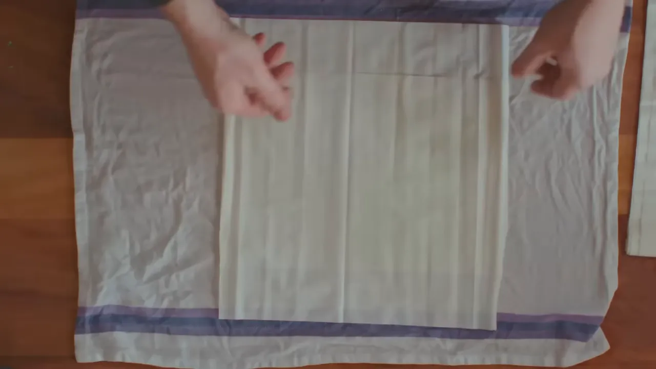 top-down view of filo pastry sheets laid on a tea towel ready for filling