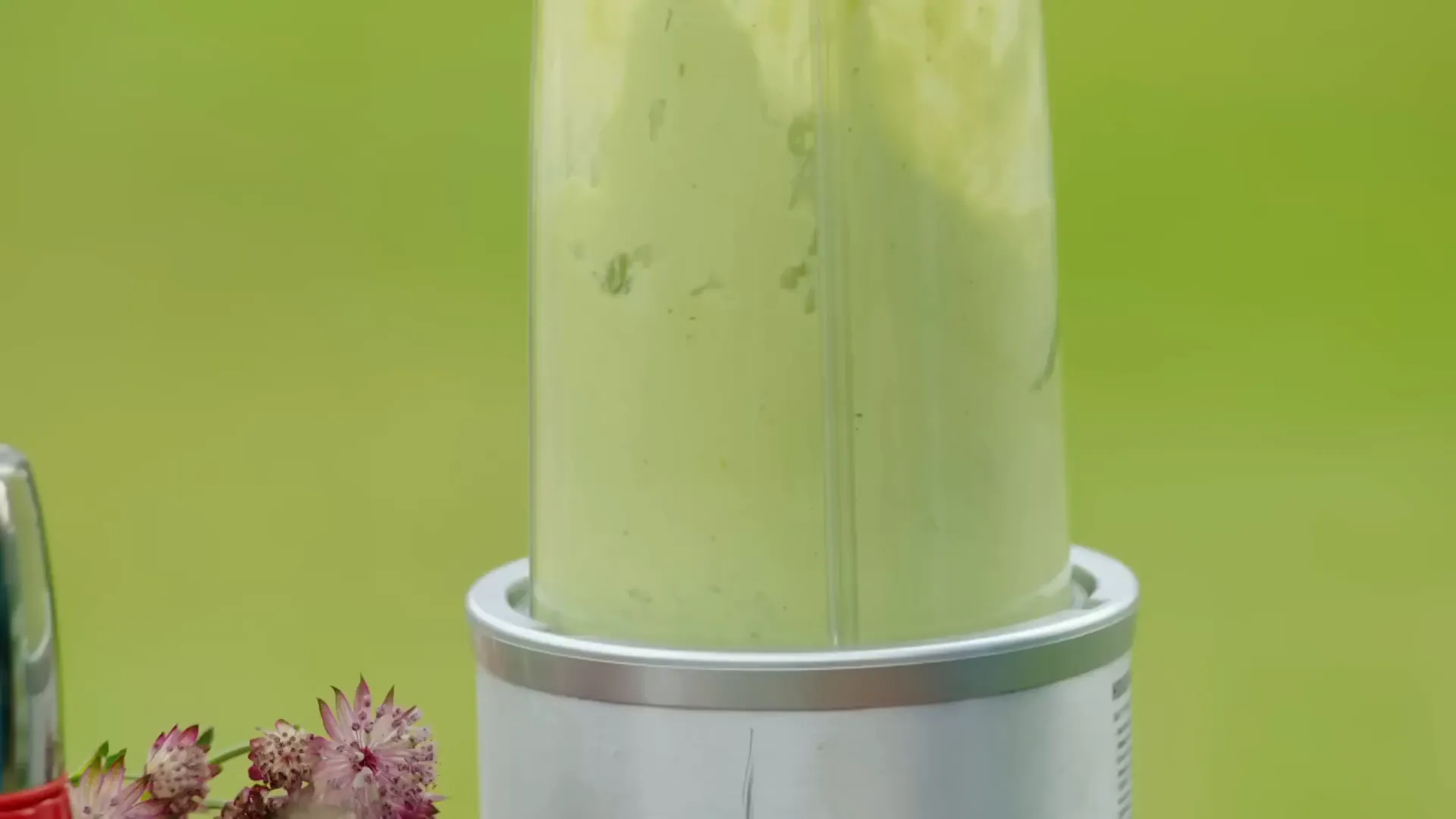 Silky, vivid green avocado and tarragon sauce in a blender