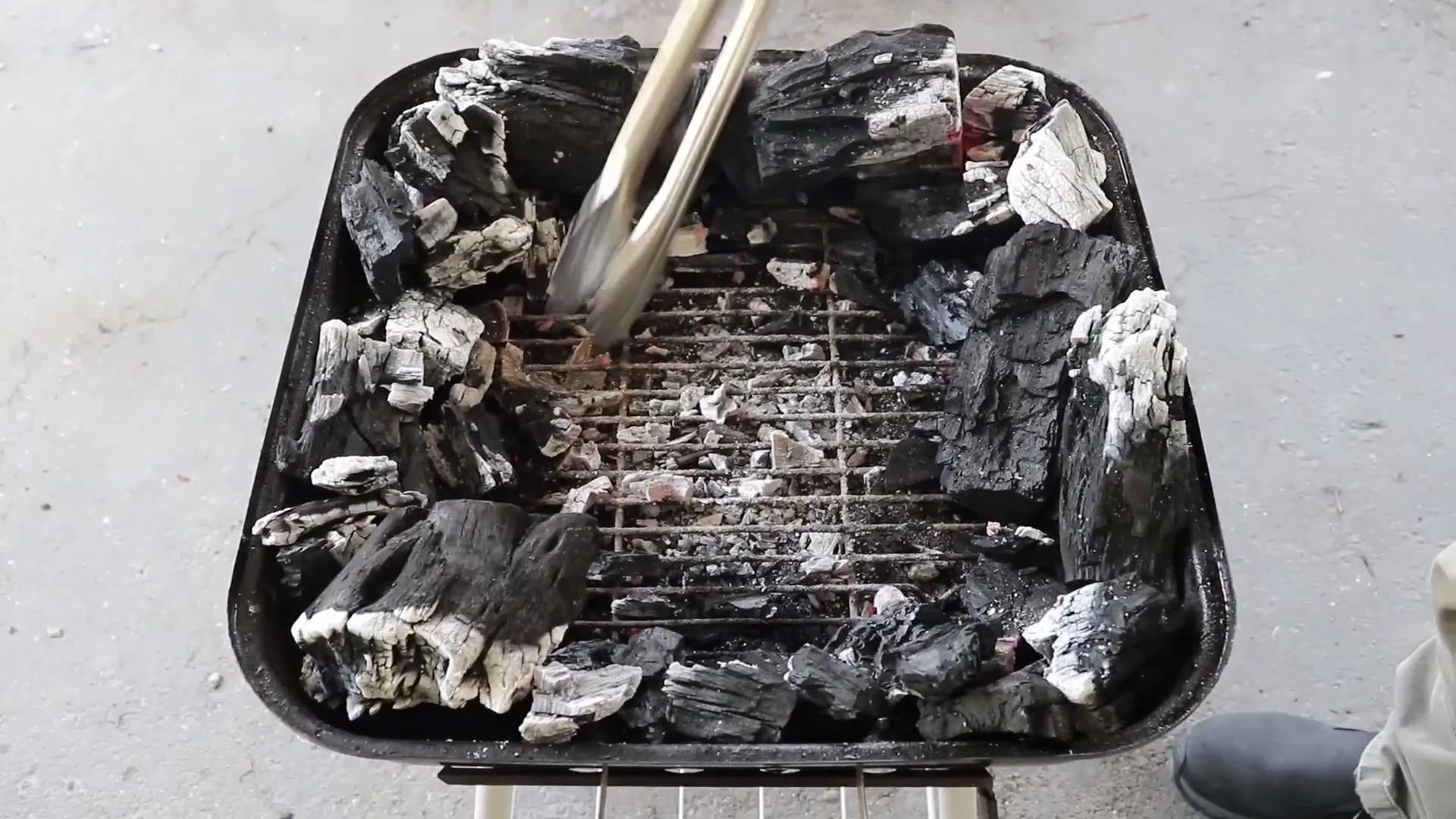 Arranged hot coals with space in center for foil pan