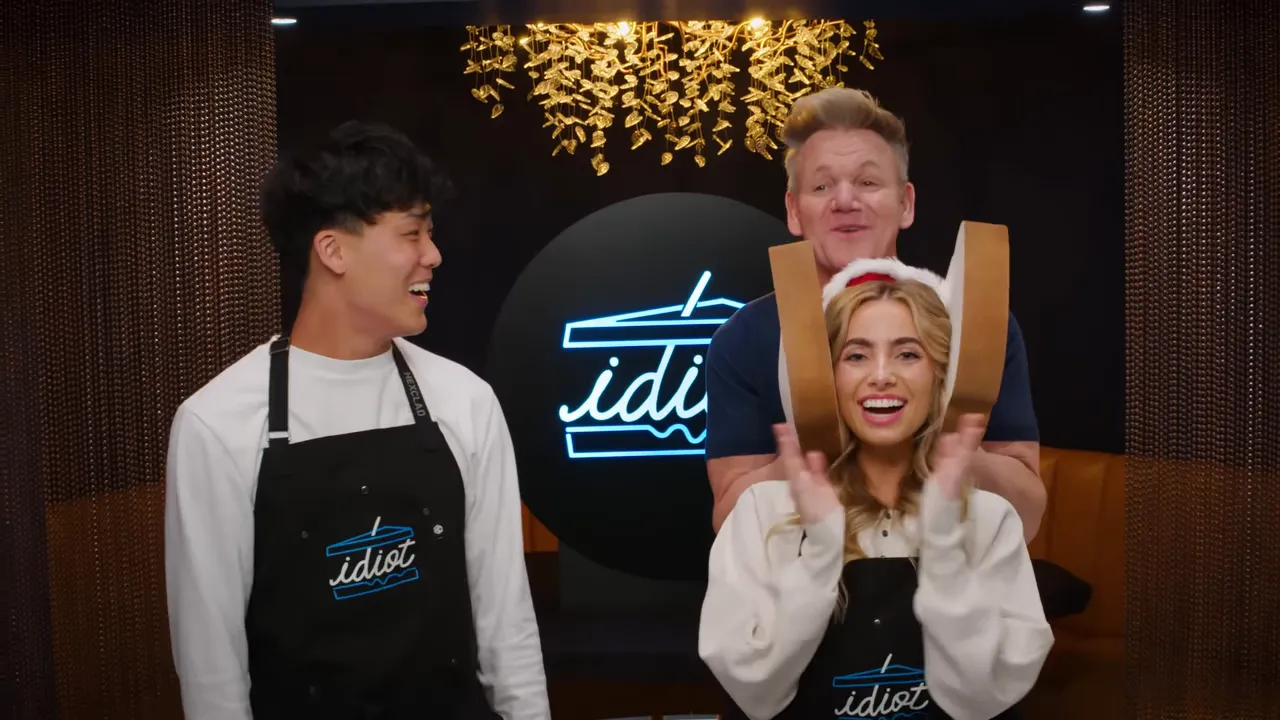 Three hosts smiling and looking at each other on set, well-lit and centered in frame.