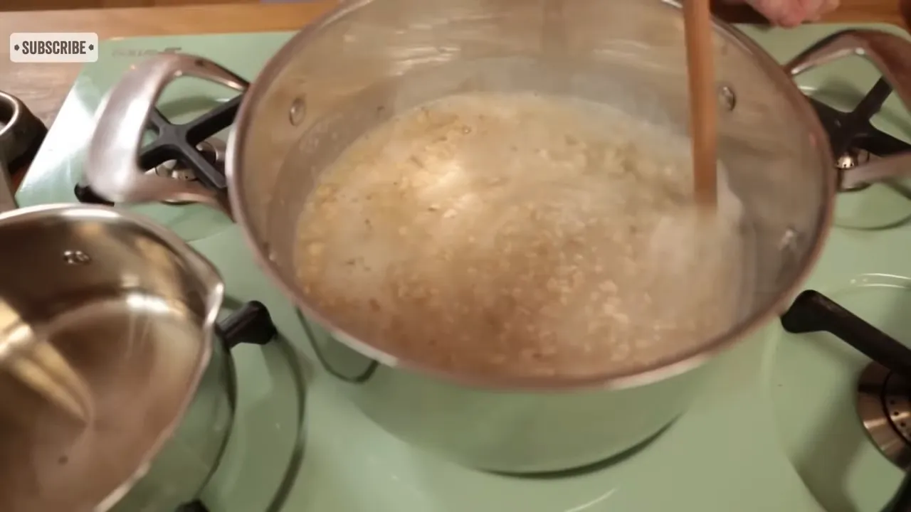 Porridge simmering in pot before turning down the heat